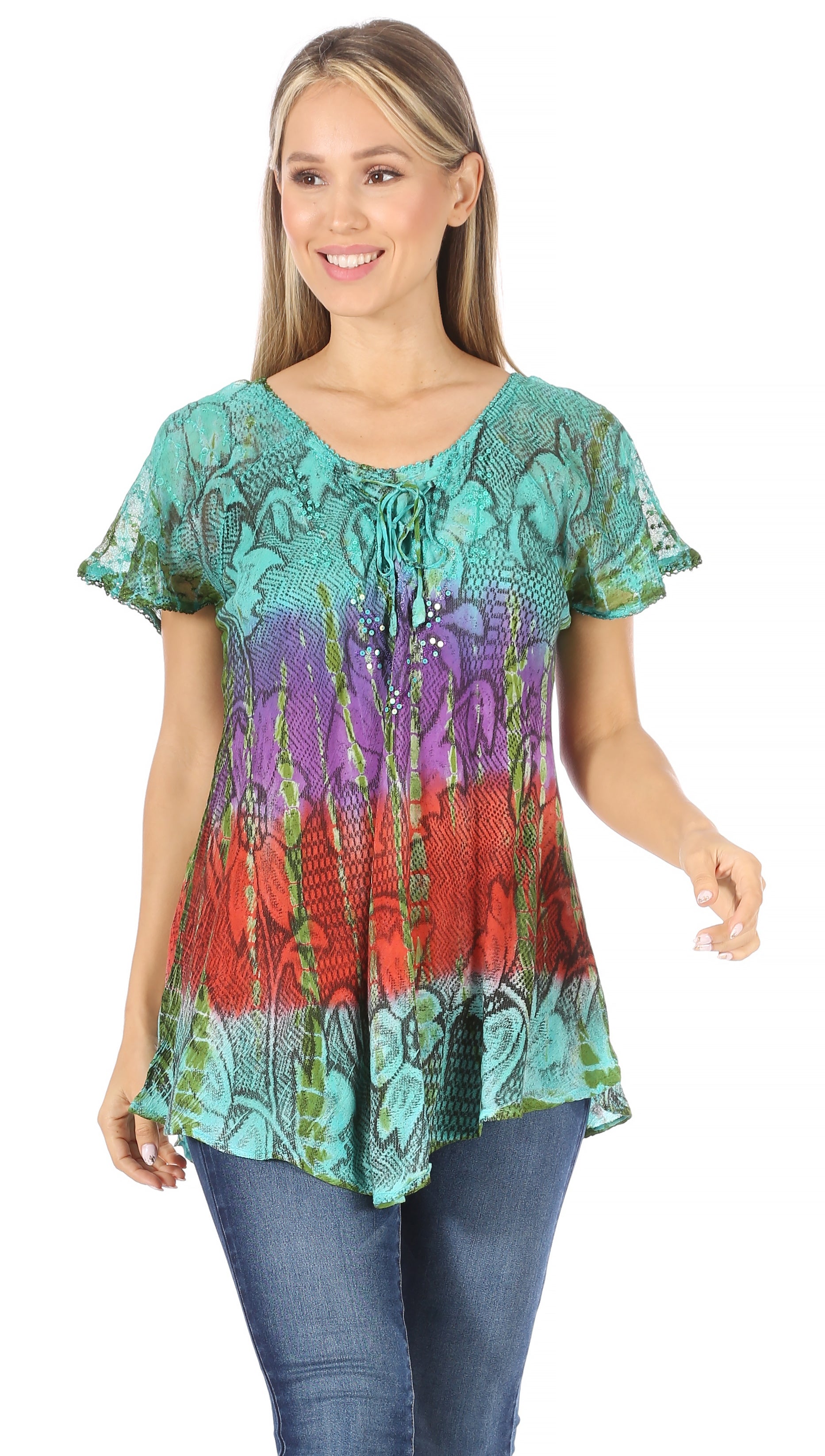 Woman wearing a colorful patterned top on a white background