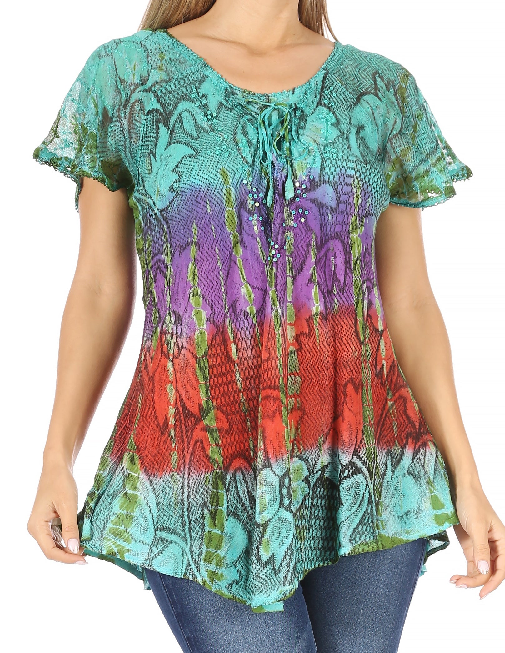Colorful patterned top worn by a person on a white background