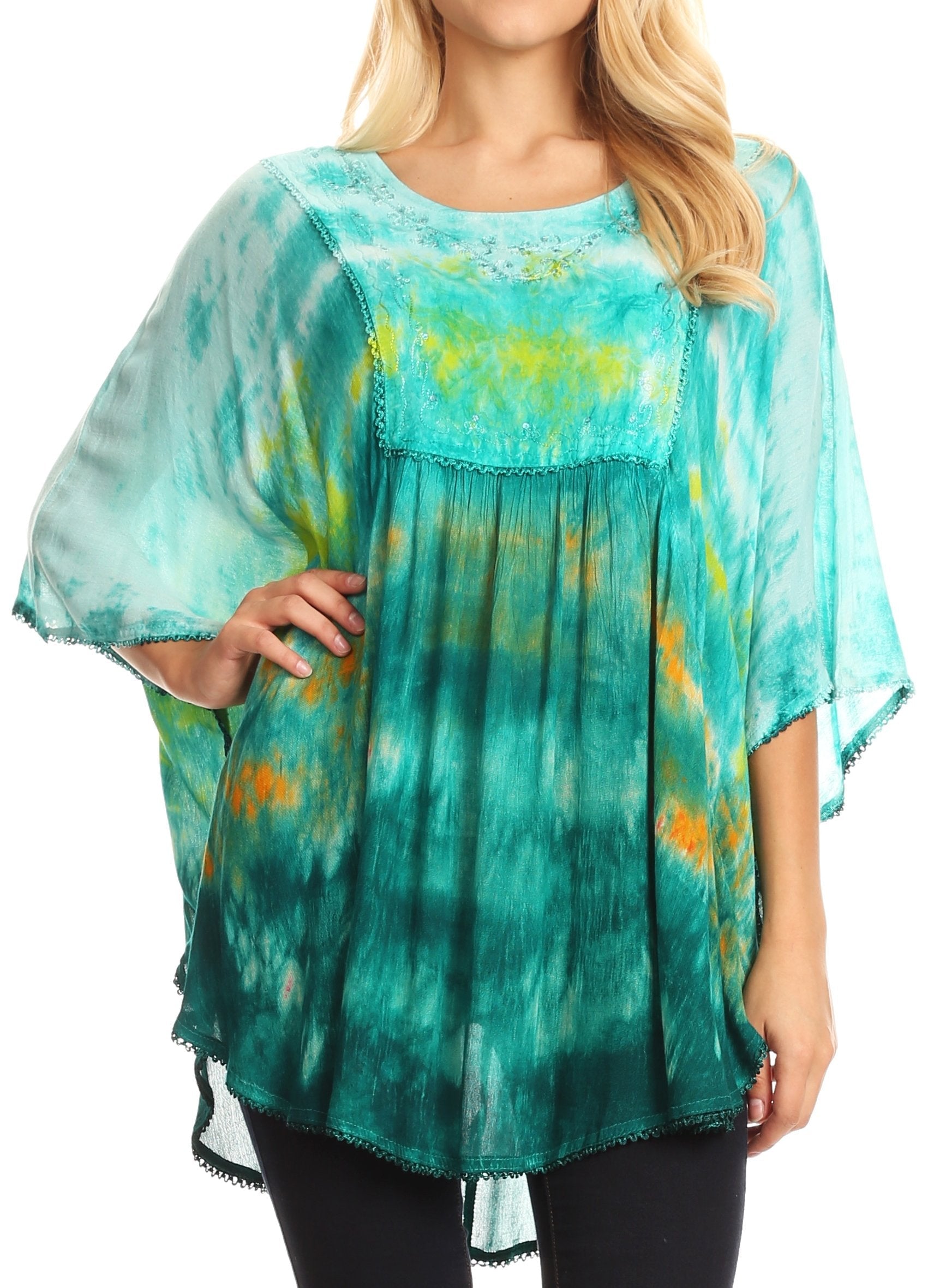 Woman wearing a teal and yellow tie-dye blouse on a white background