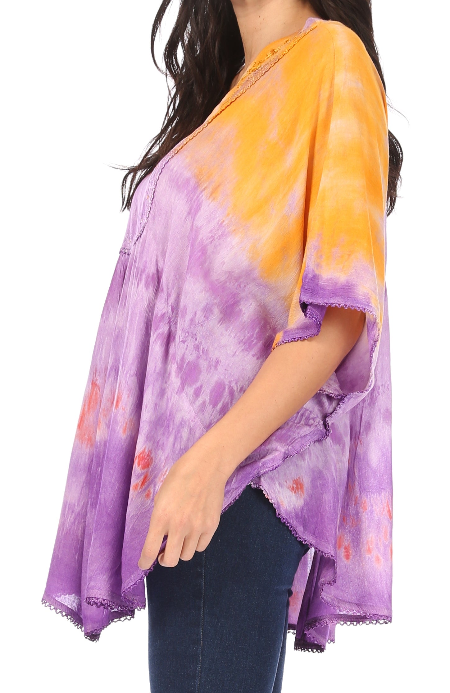 Woman wearing a purple and orange tie-dye kimono-style top.