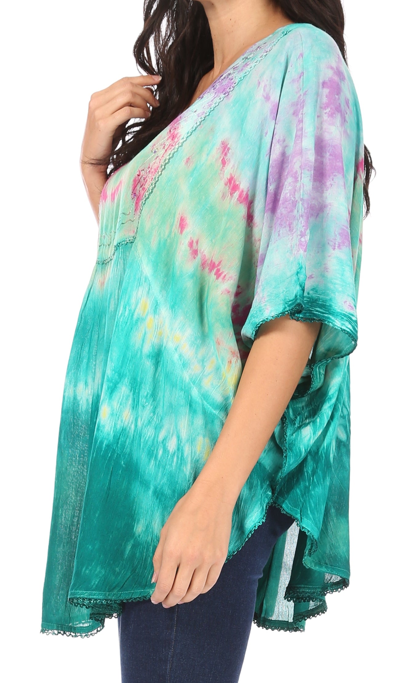 Woman wearing a tie-dye kimono-style top with a white background