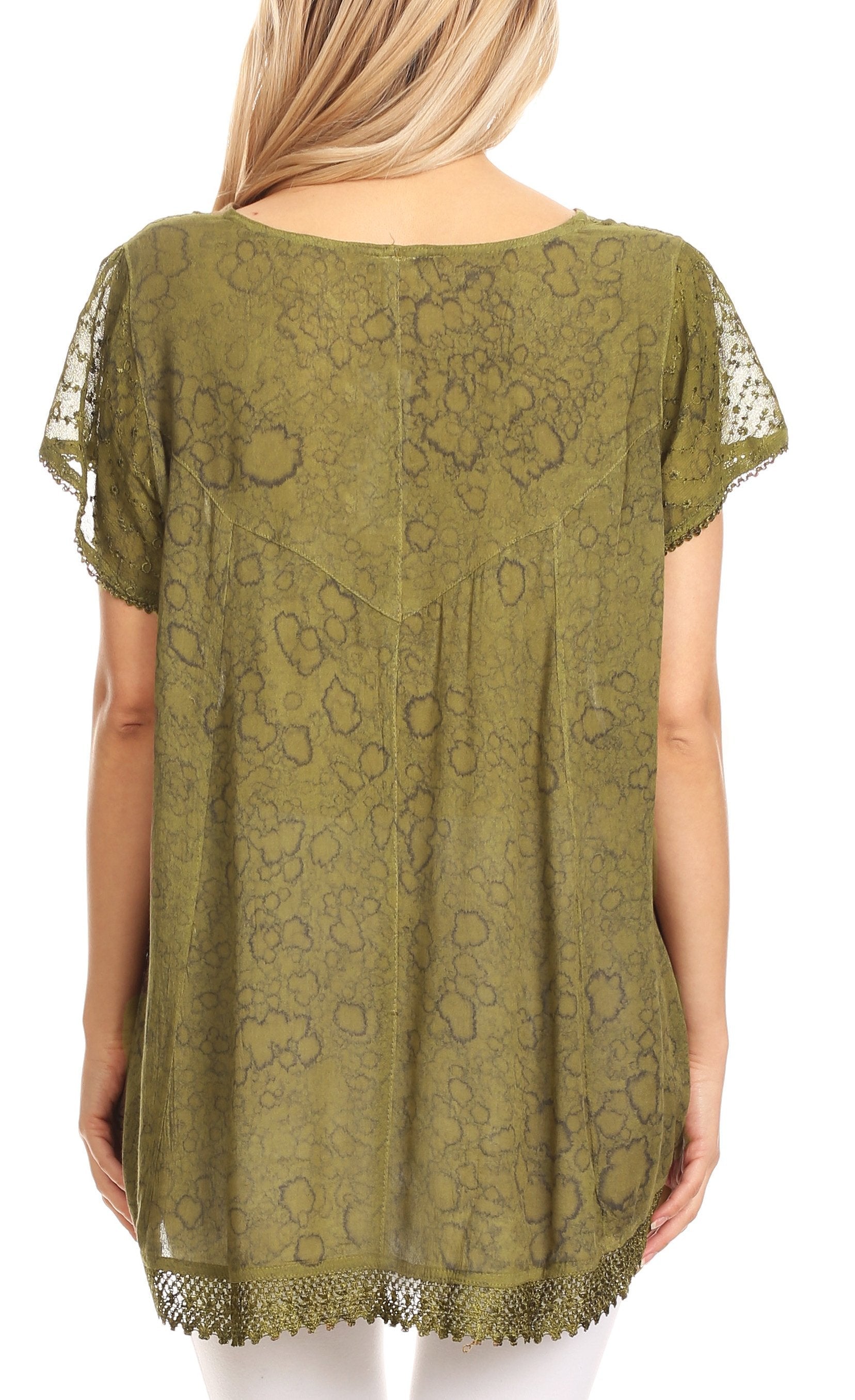 Green lace top worn by a person on a white background