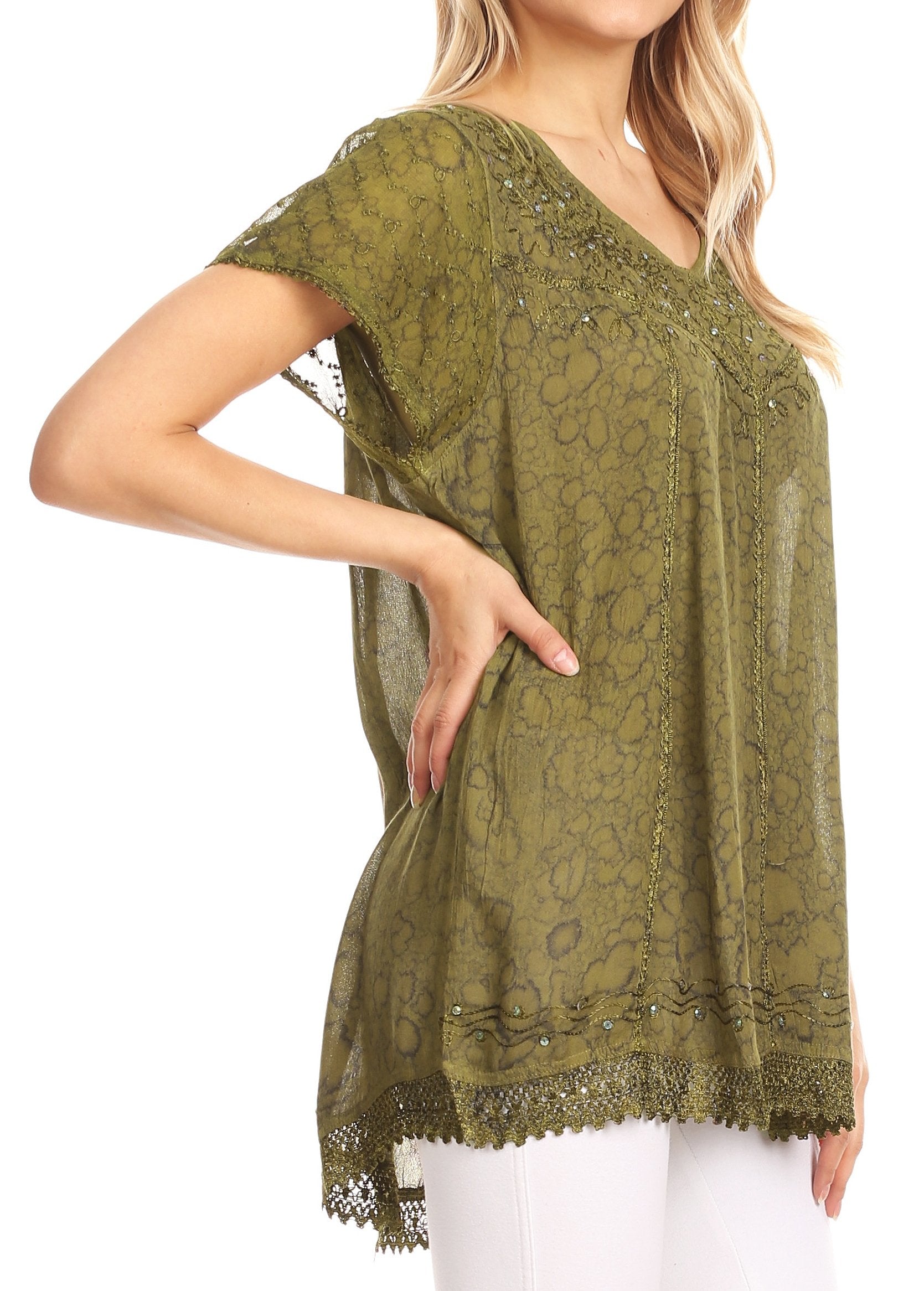 Green lace top worn by a person on a white background