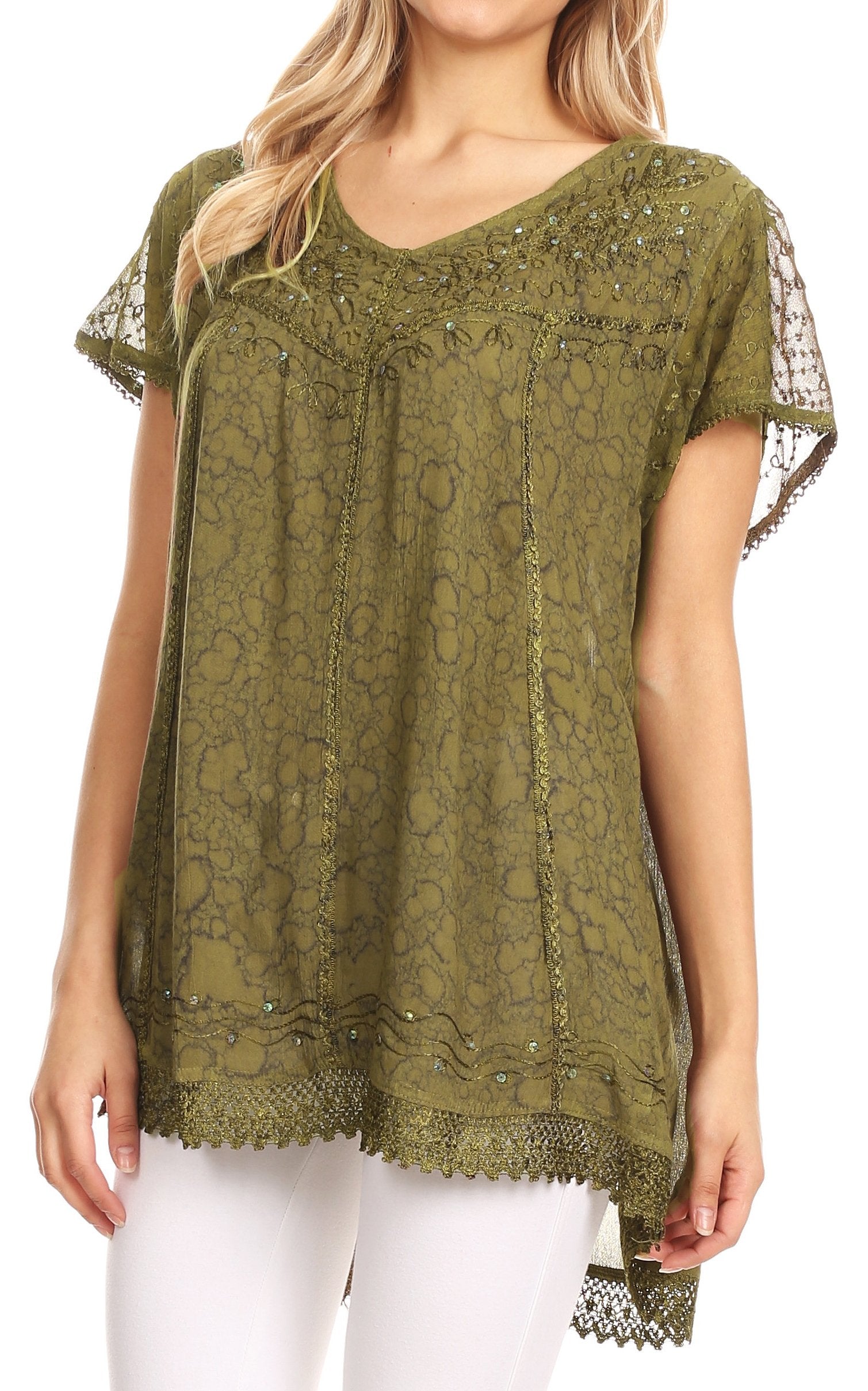 Woman wearing a green lace top with sheer sleeves on a white background