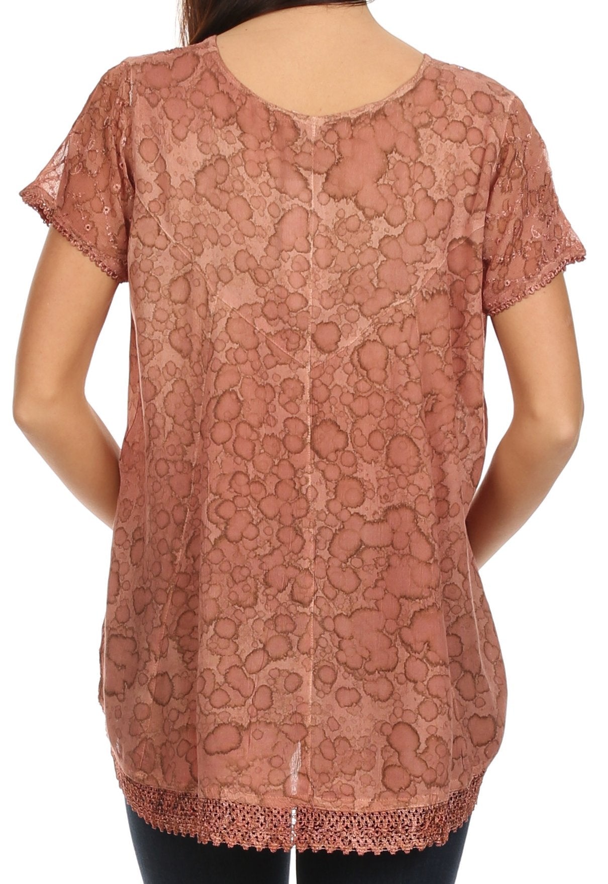 Rose gold lace top worn by a person on a white background