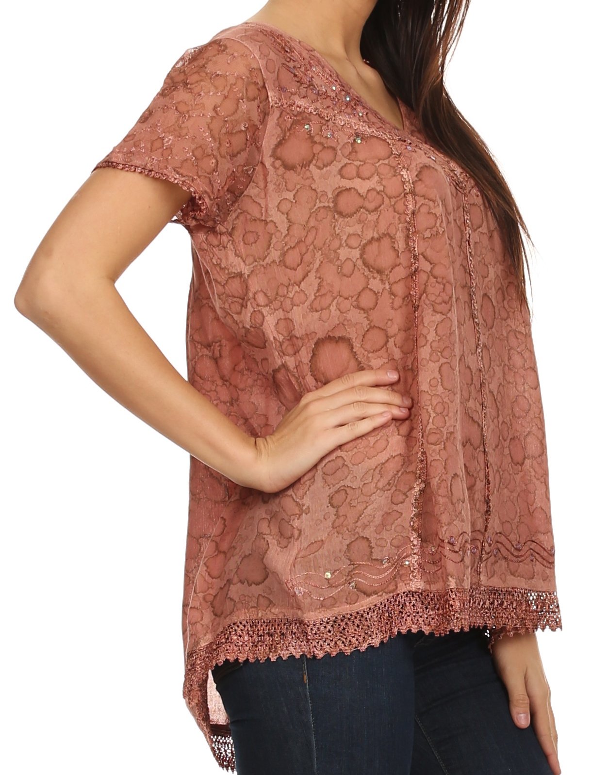 Pink lace top worn by a person on a white background