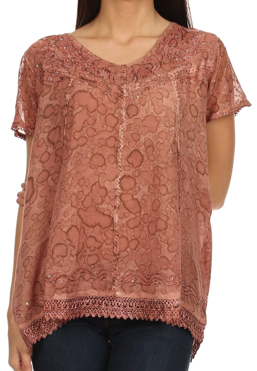 Pink lace top worn by a person on a white background