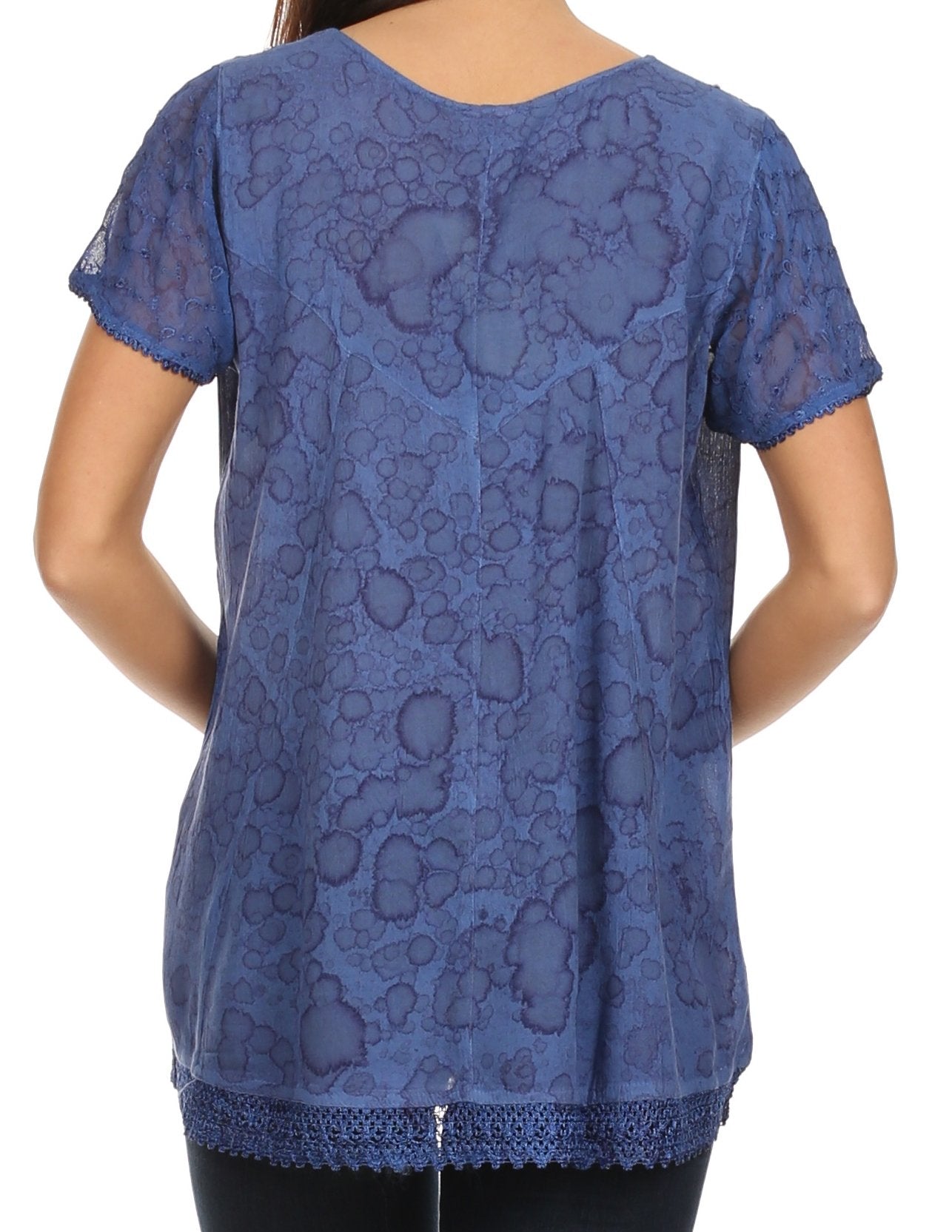 Blue lace top worn by a person on a white background
