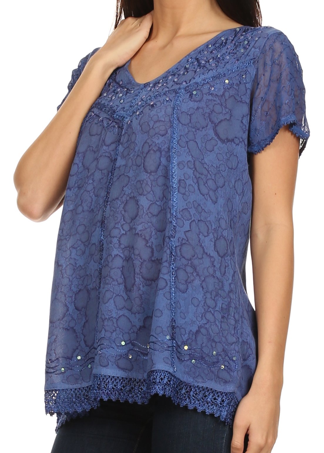 Blue lace top worn by a model on a white background