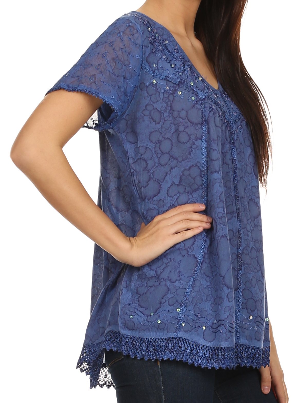 Blue lace top worn by a person on a white background