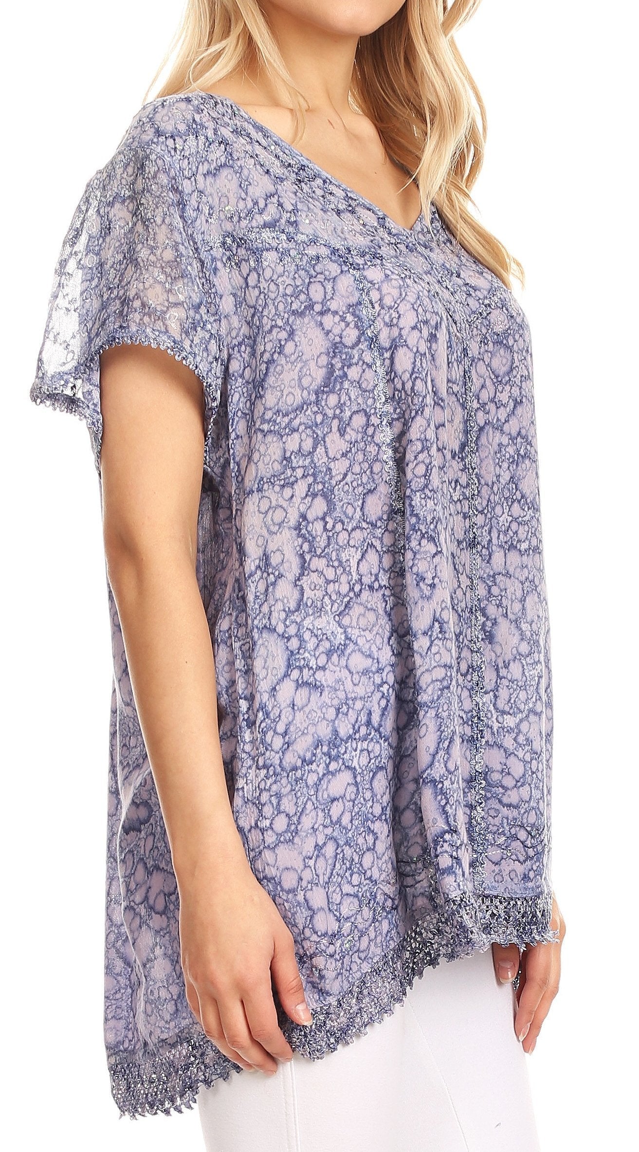 Woman wearing a blue floral patterned blouse on a white background