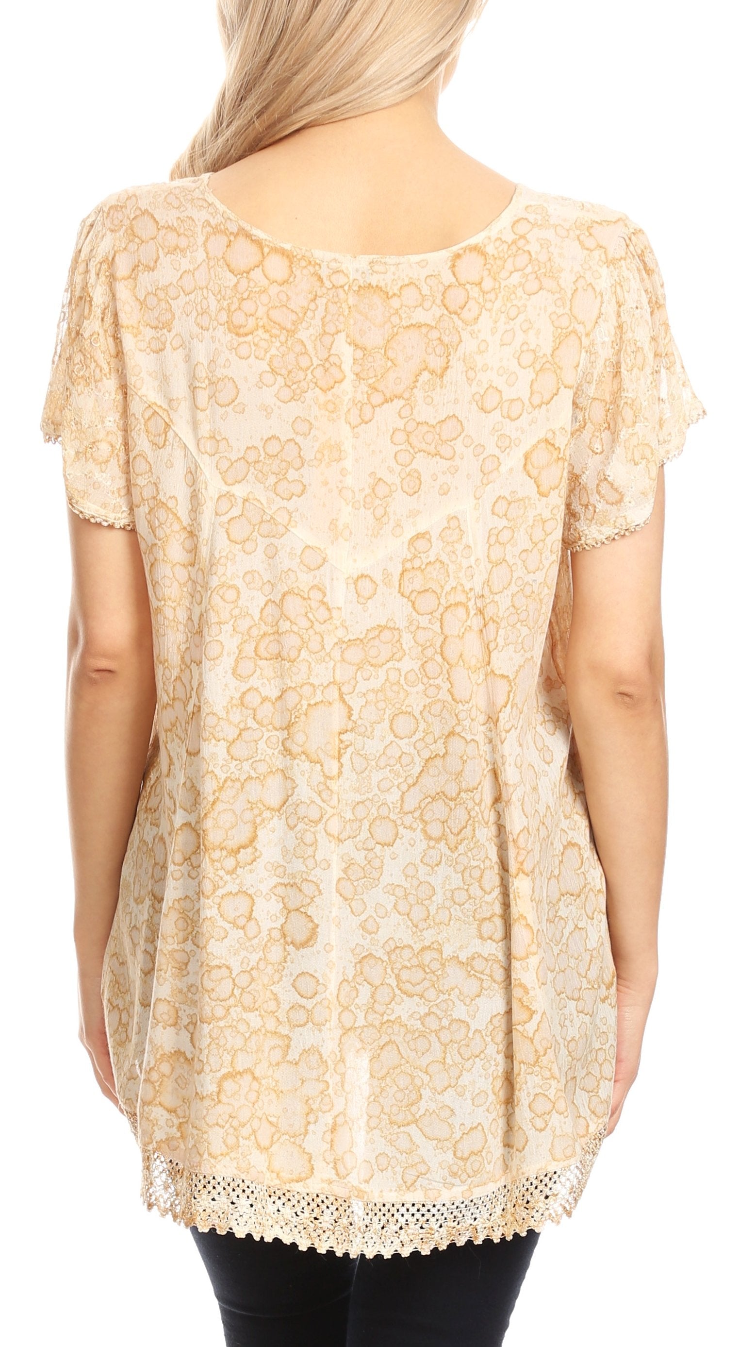 Beige lace top worn by a person on a white background