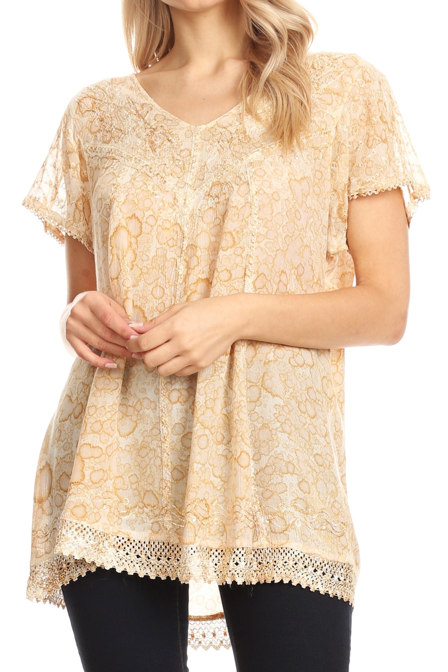 Beige lace top worn by a person on a white background
