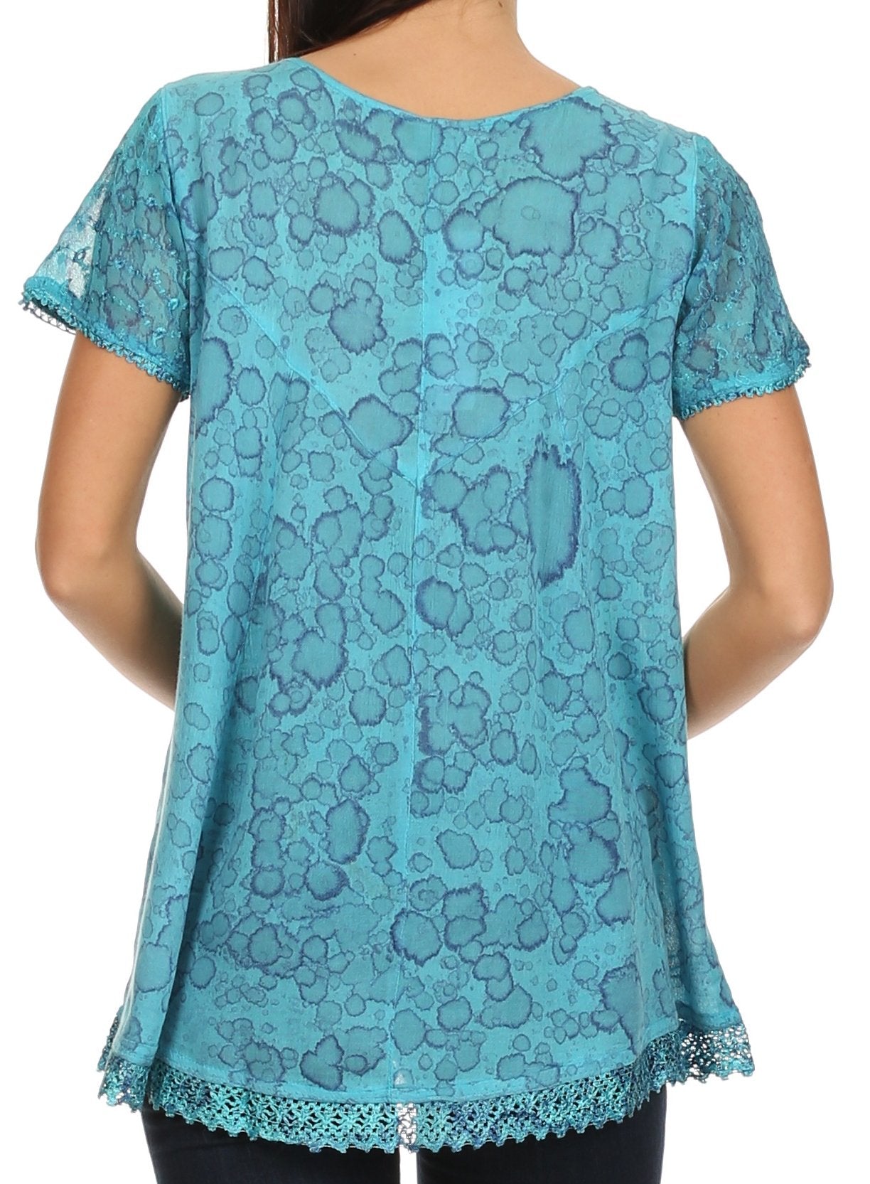Blue lace top worn by a person on a white background