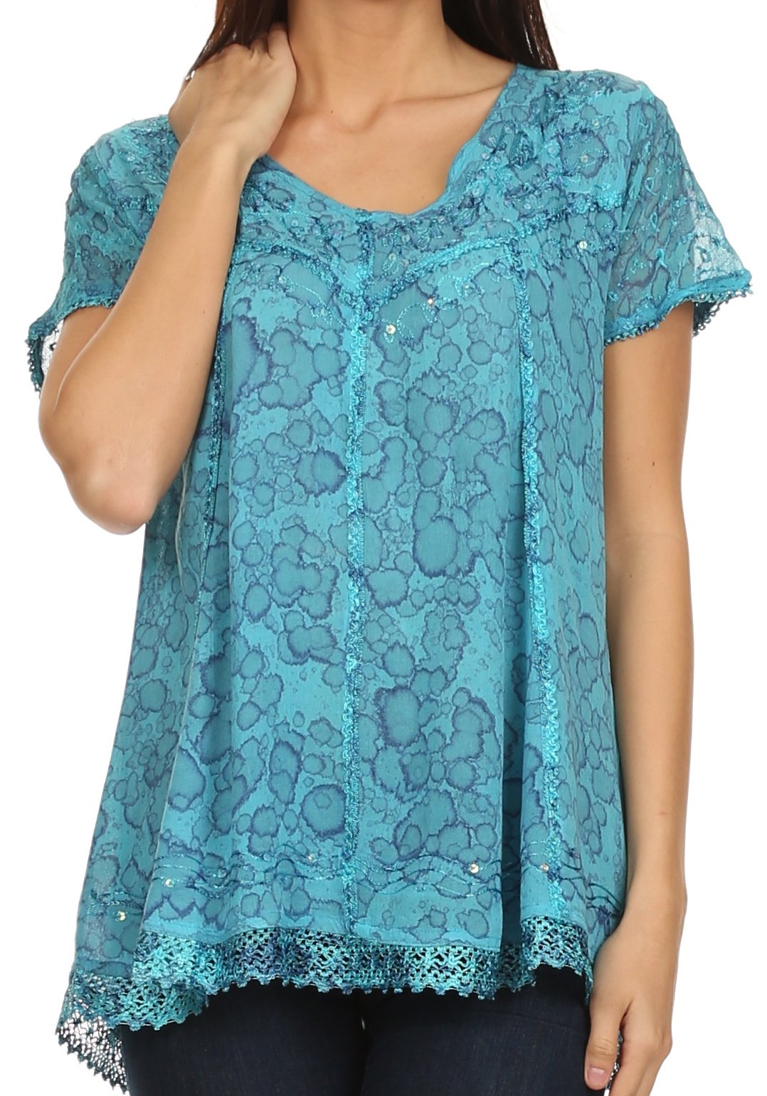 Teal lace top worn by a person on a white background