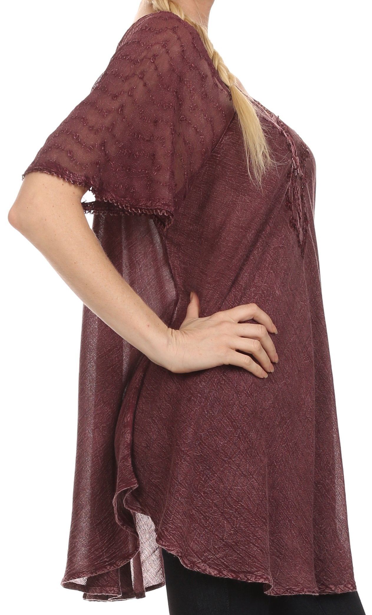 Maroon lace top worn by a person on a white background