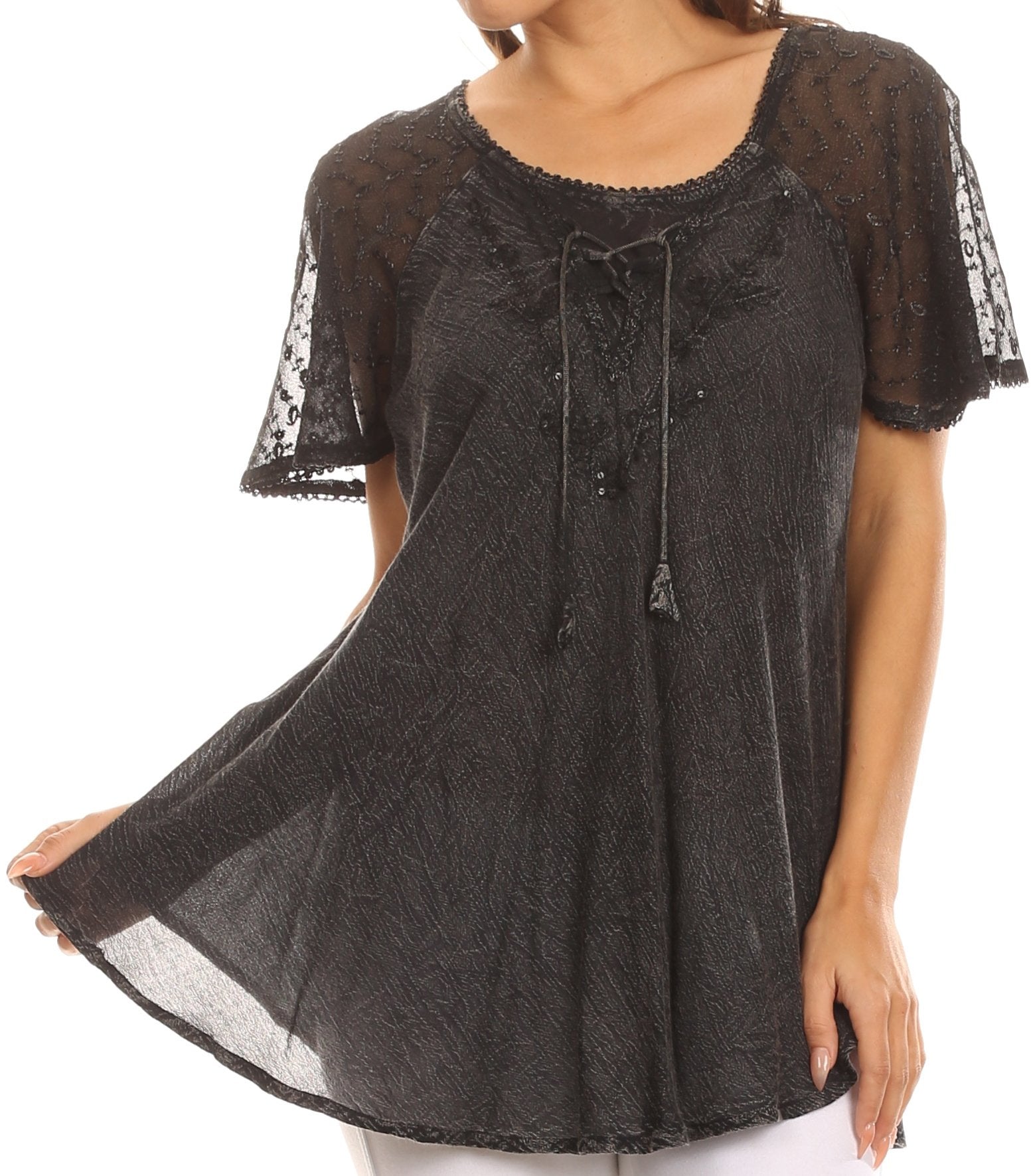 Black lace top worn by a model on a white background