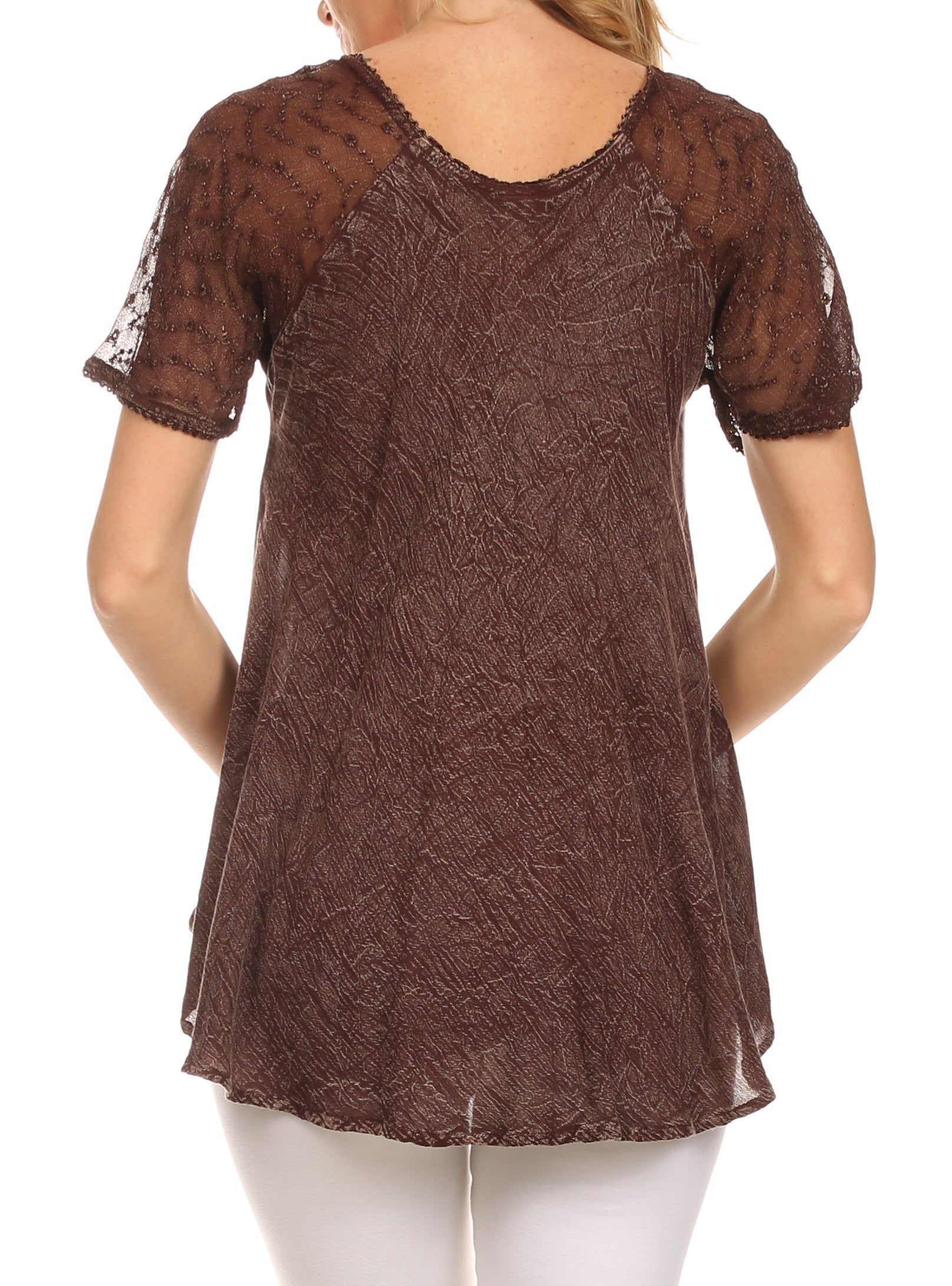 Brown lace top worn by a person on a white background