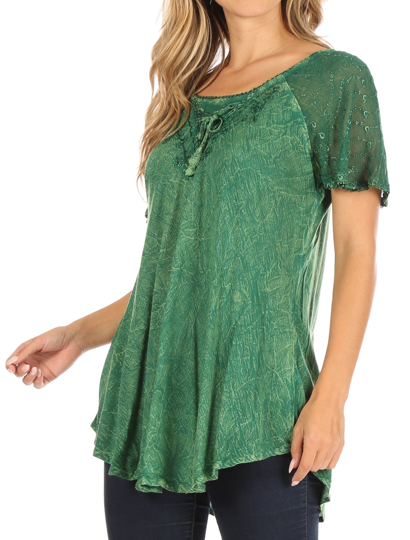 Woman wearing a green patterned top on a white background