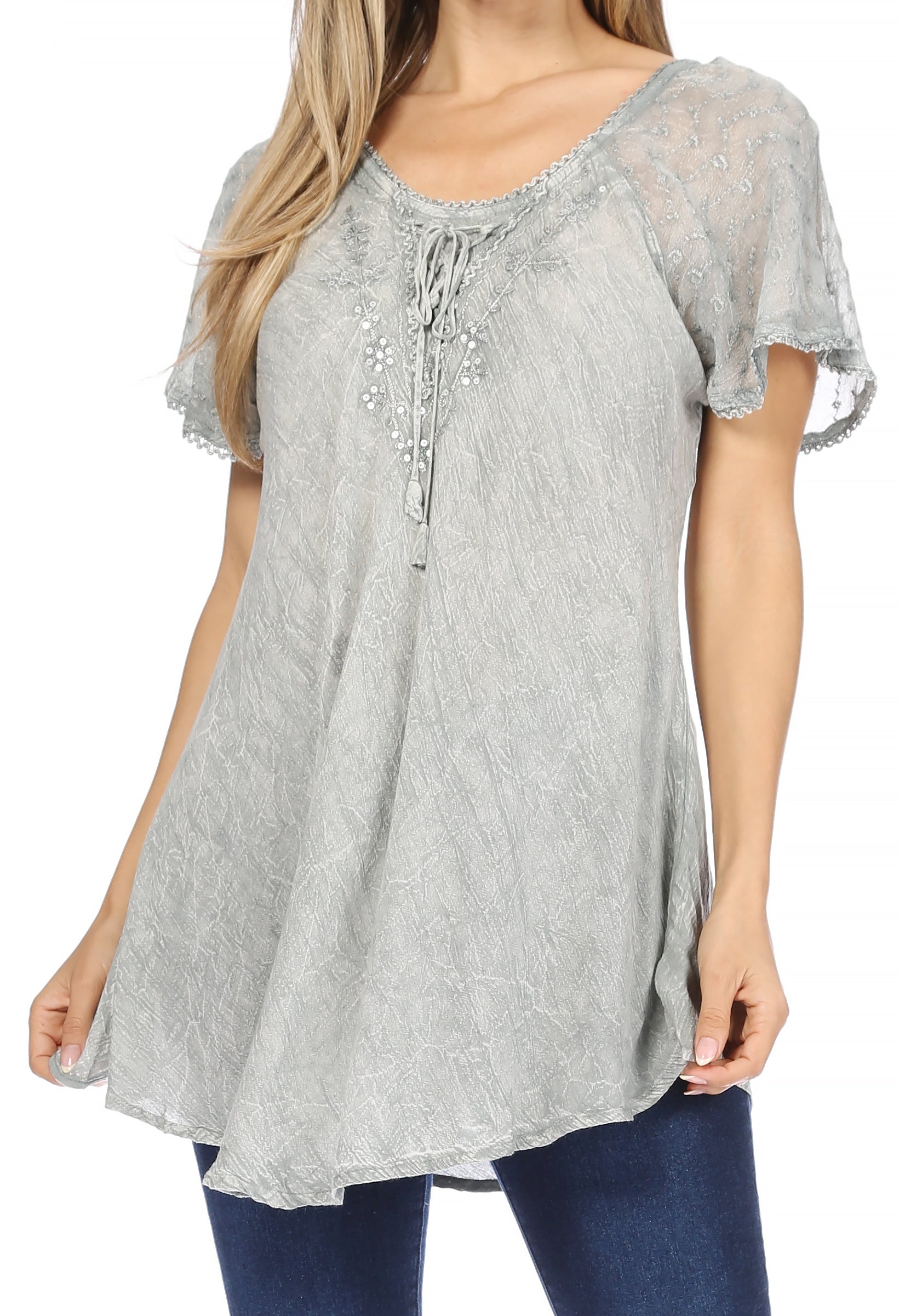 Woman wearing a gray lace top with short sleeves on a white background