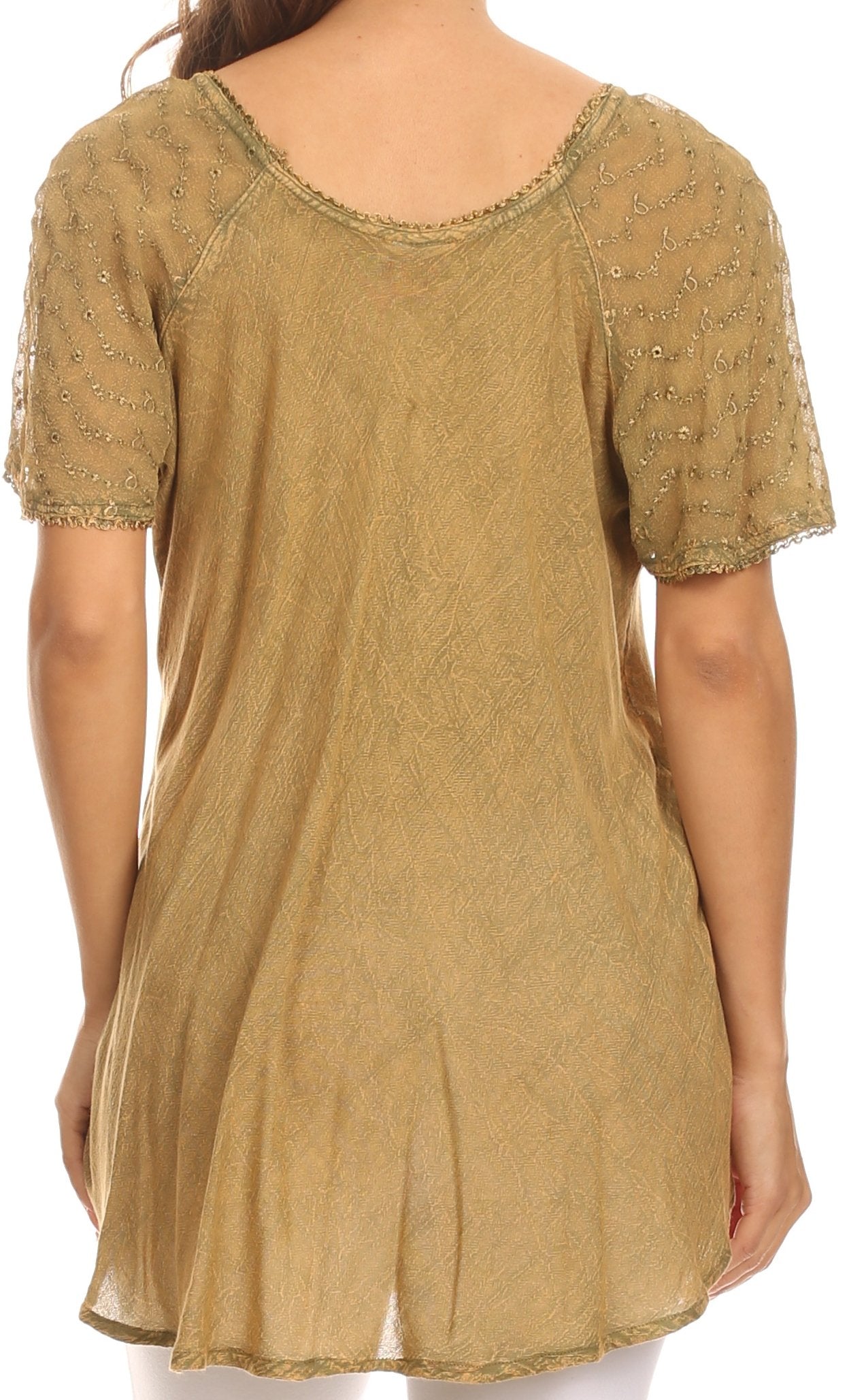 Gold embroidered tunic on a white background