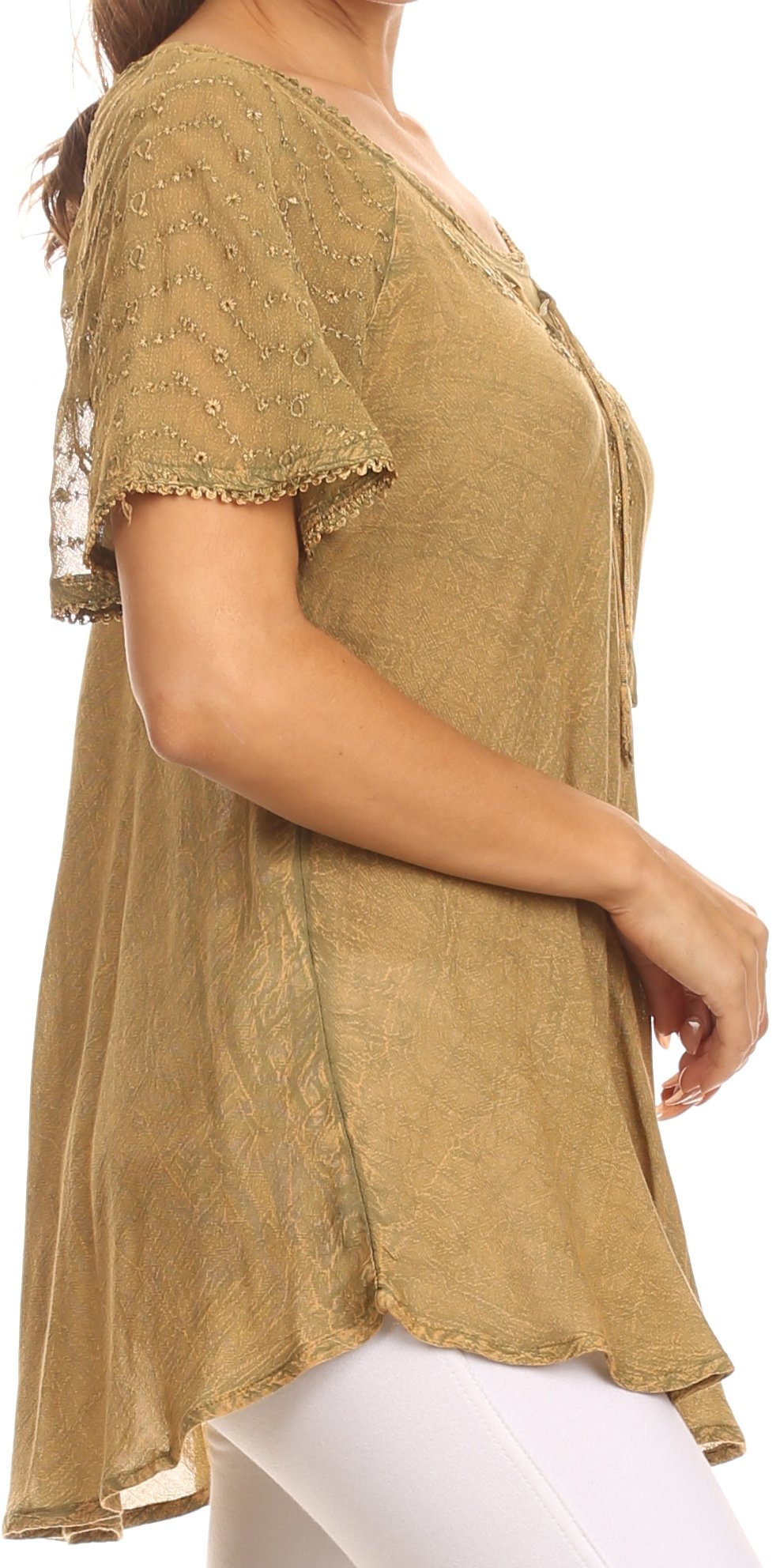 Woman wearing a mustard yellow lace top on a white background