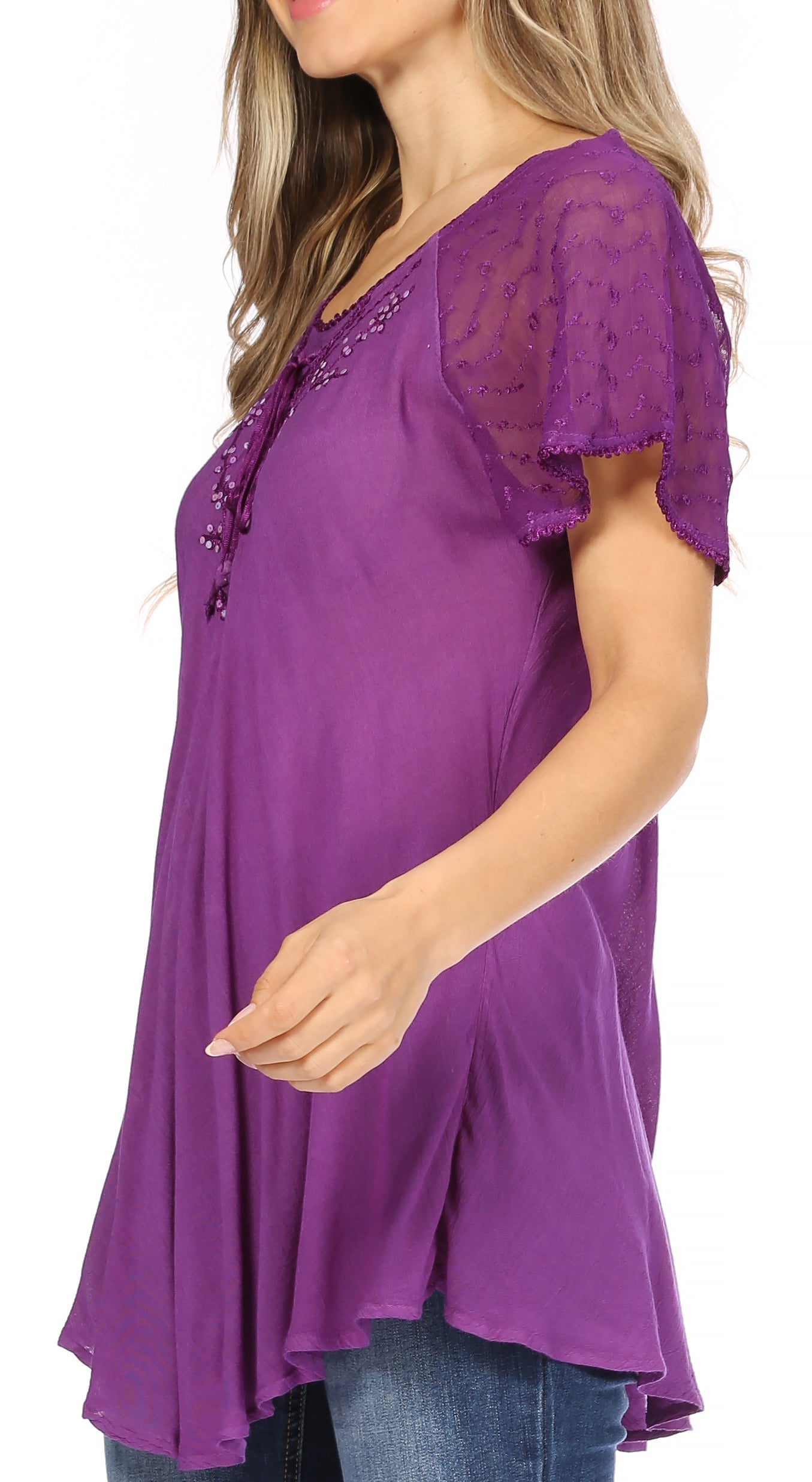 Purple top with lace sleeves worn by a person on a white background