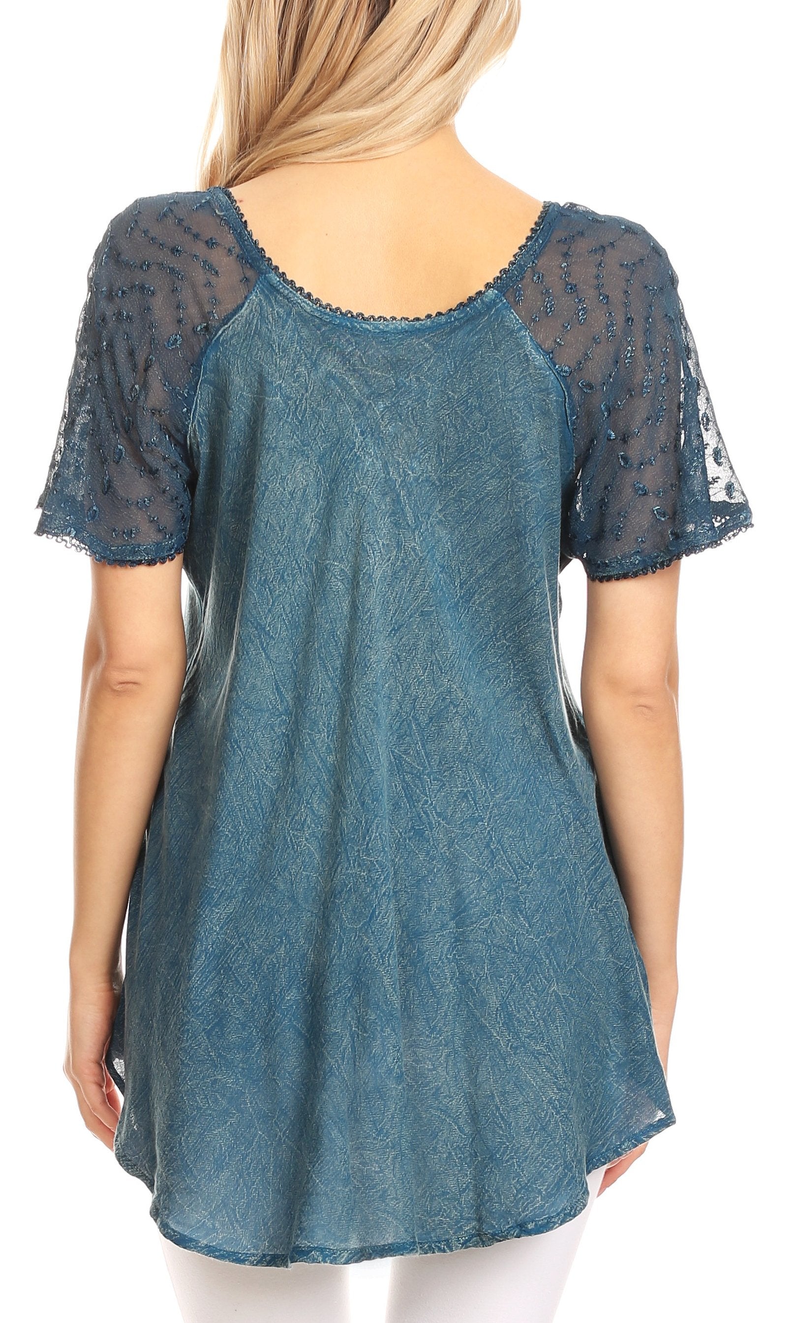 Blue lace top worn by a person on a white background
