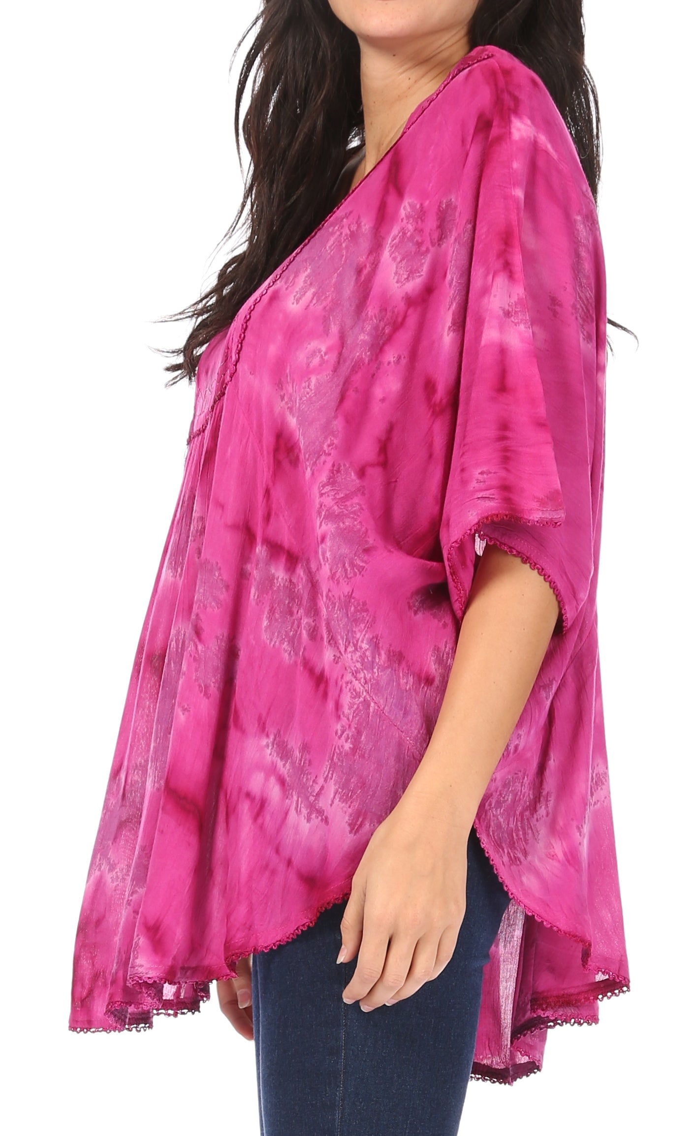 Woman wearing a pink tie-dye kimono-style top on a white background