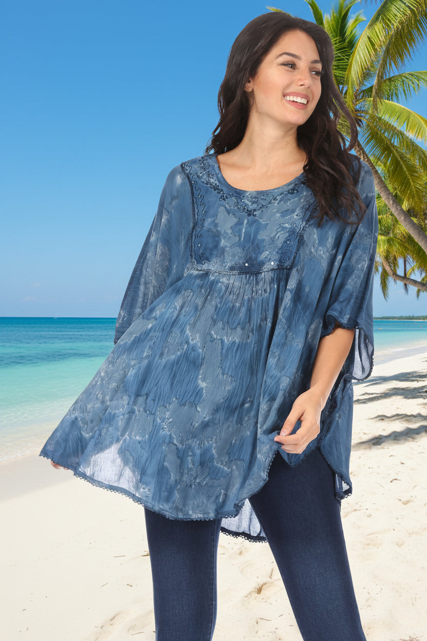 Woman wearing a blue floral patterned top on a white background
