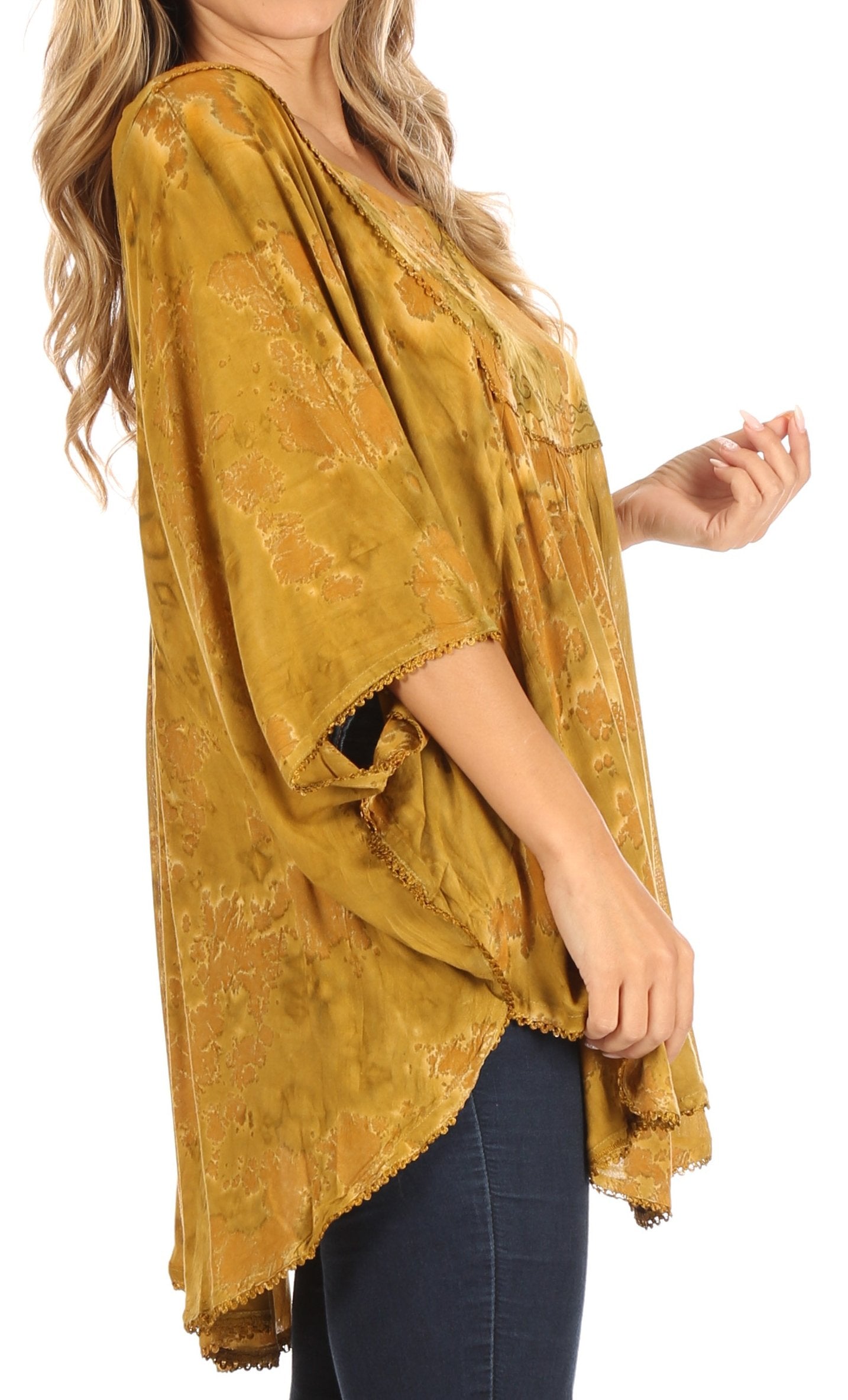 Mustard yellow textured top worn by a person on a white background