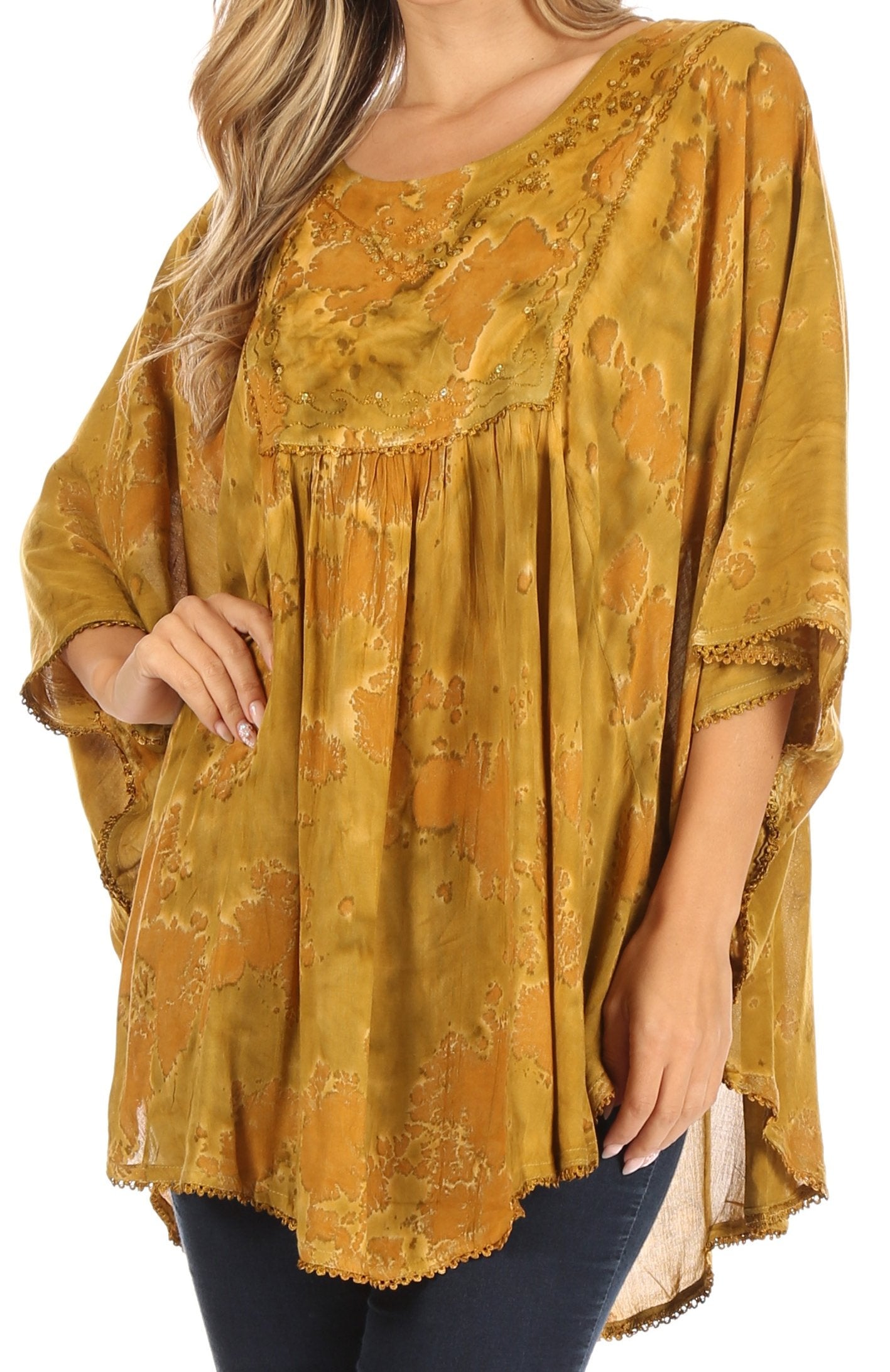 Yellow patterned blouse worn by a person on a white background