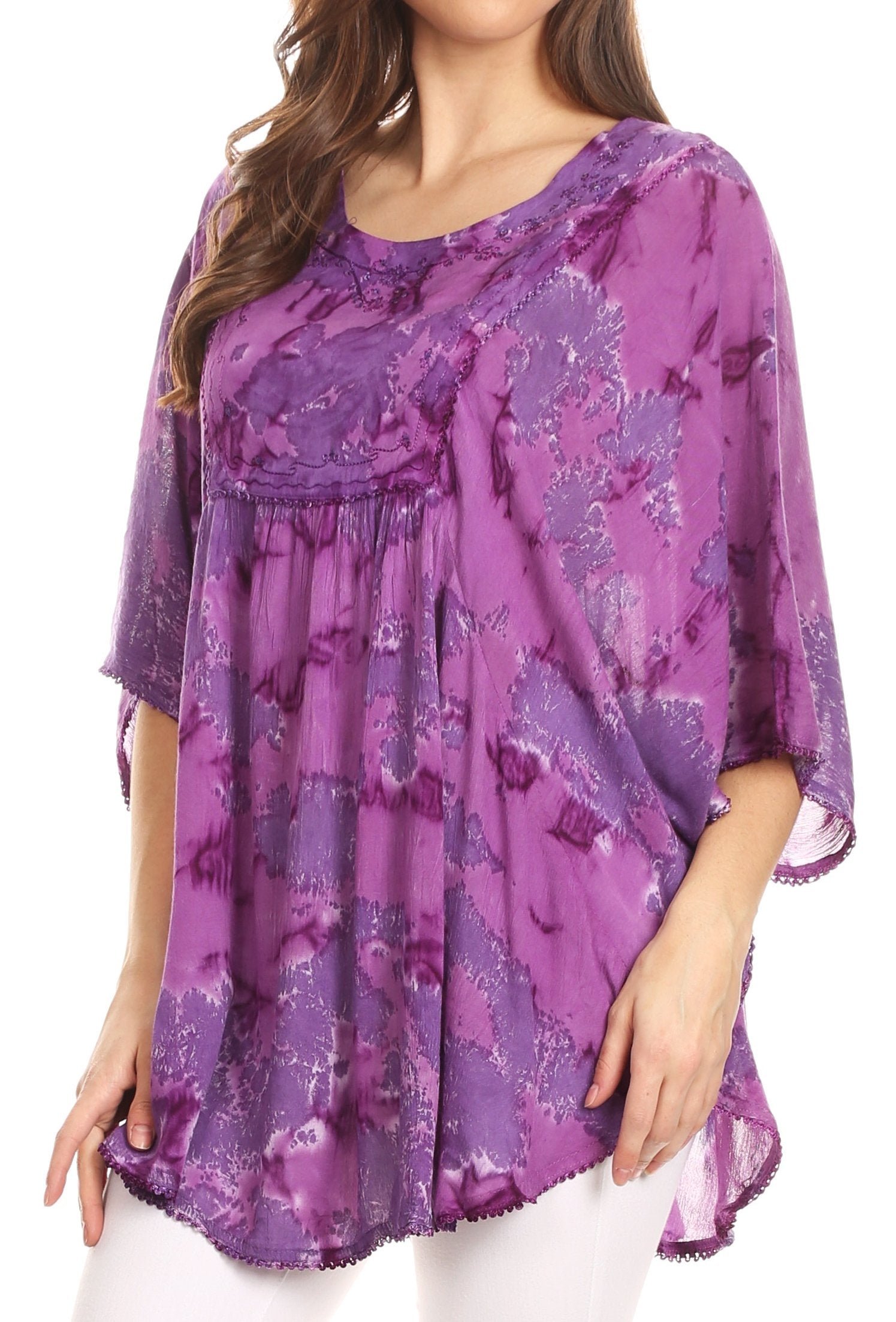 Purple patterned top worn by a model on a white background