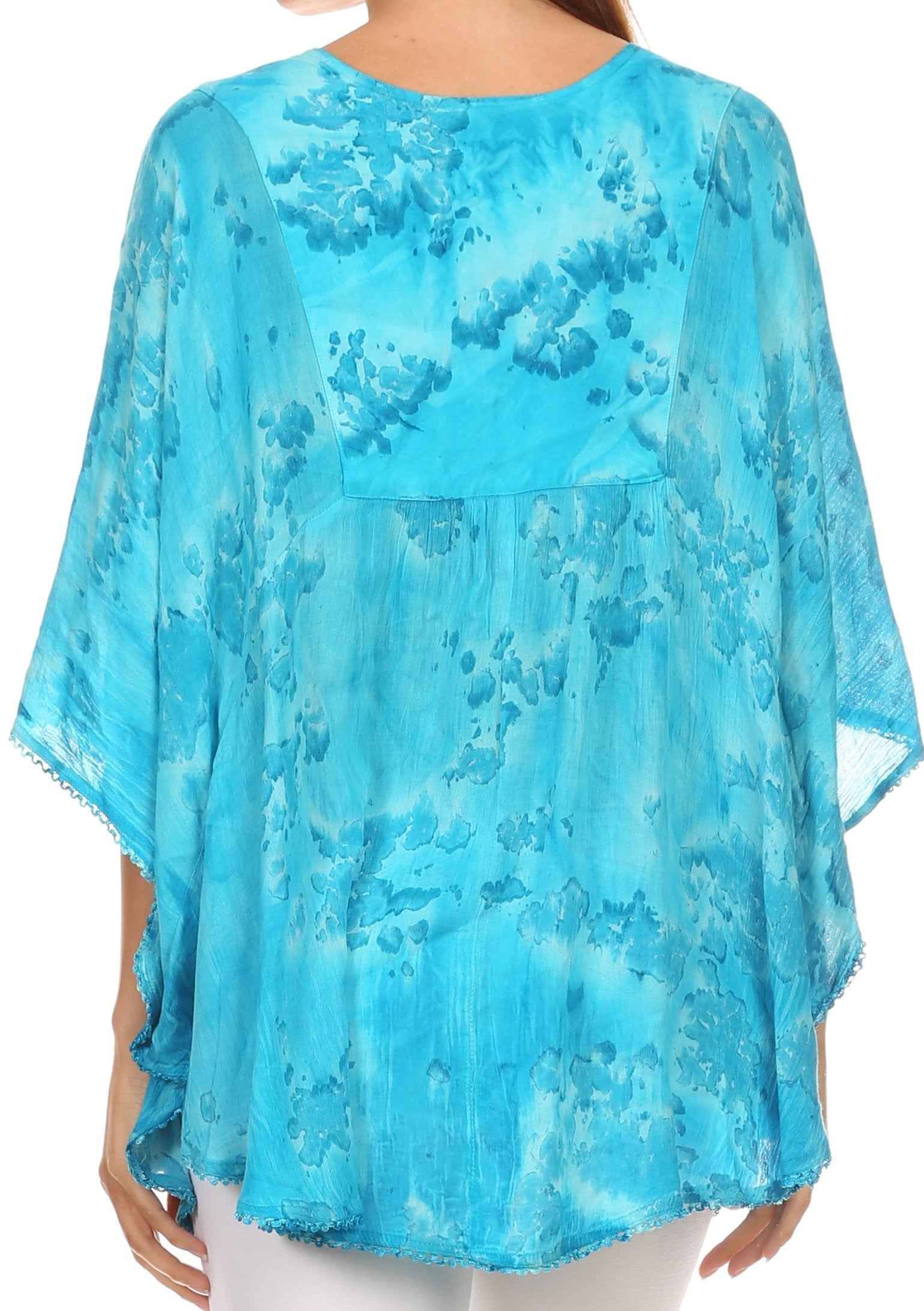 Blue floral patterned top worn by a person on a white background