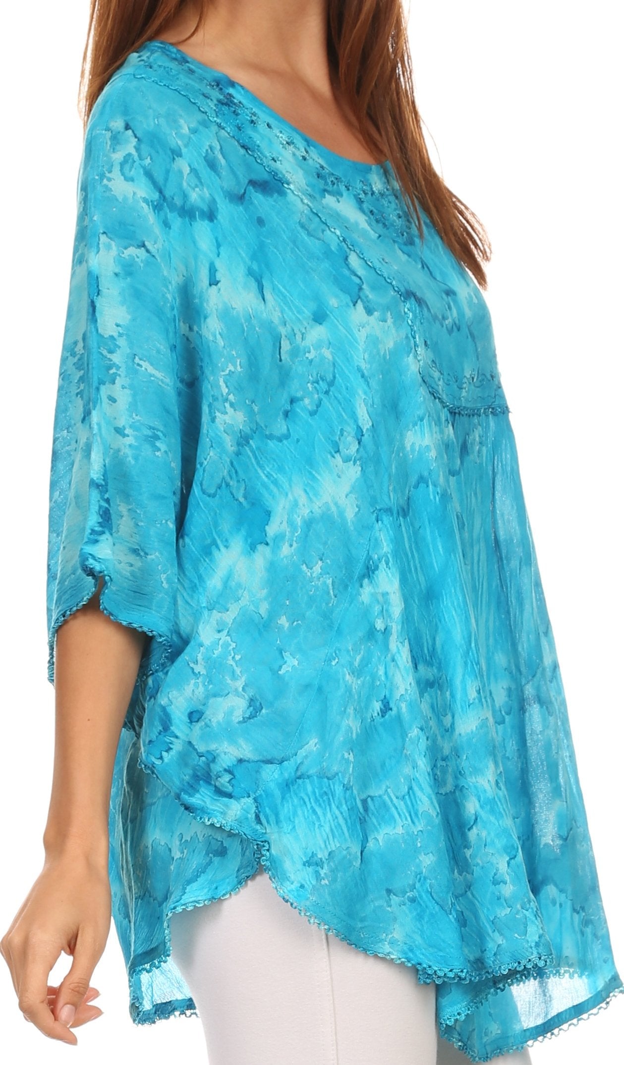 Blue lace top worn by a person on a white background