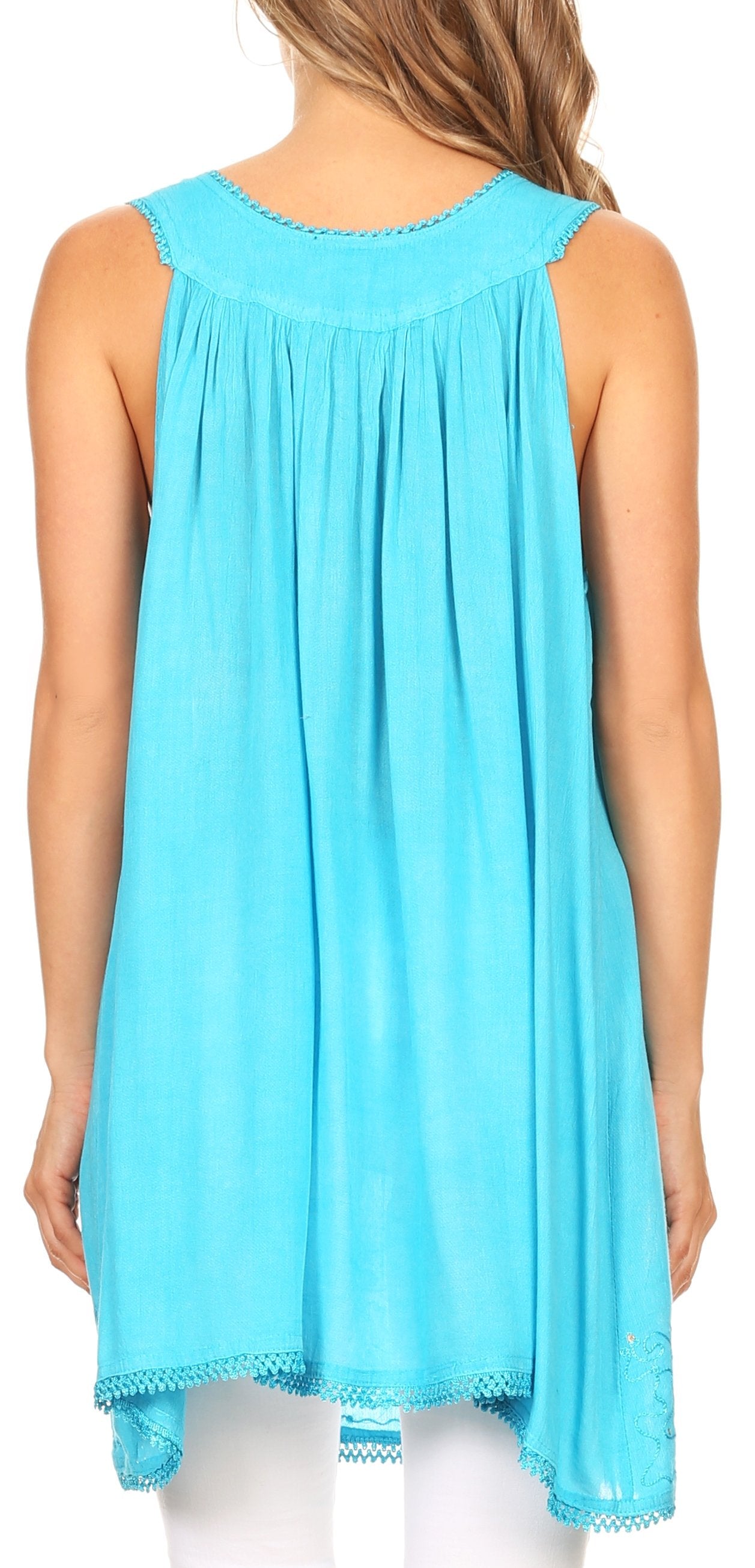 Woman wearing a light blue sleeveless top with lace trim
