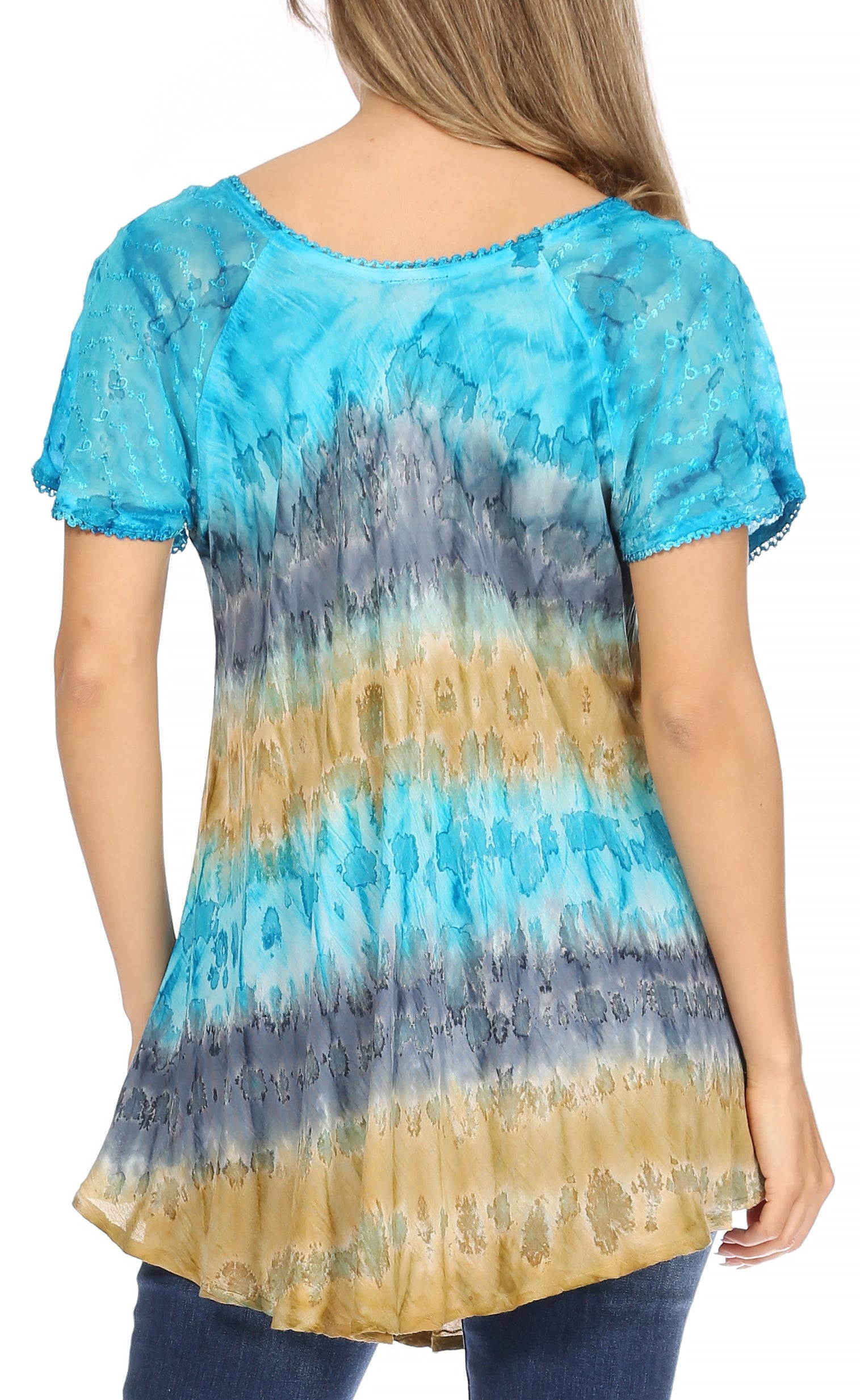 Woman wearing a tie-dye shirt with blue, yellow, and gray gradient.
