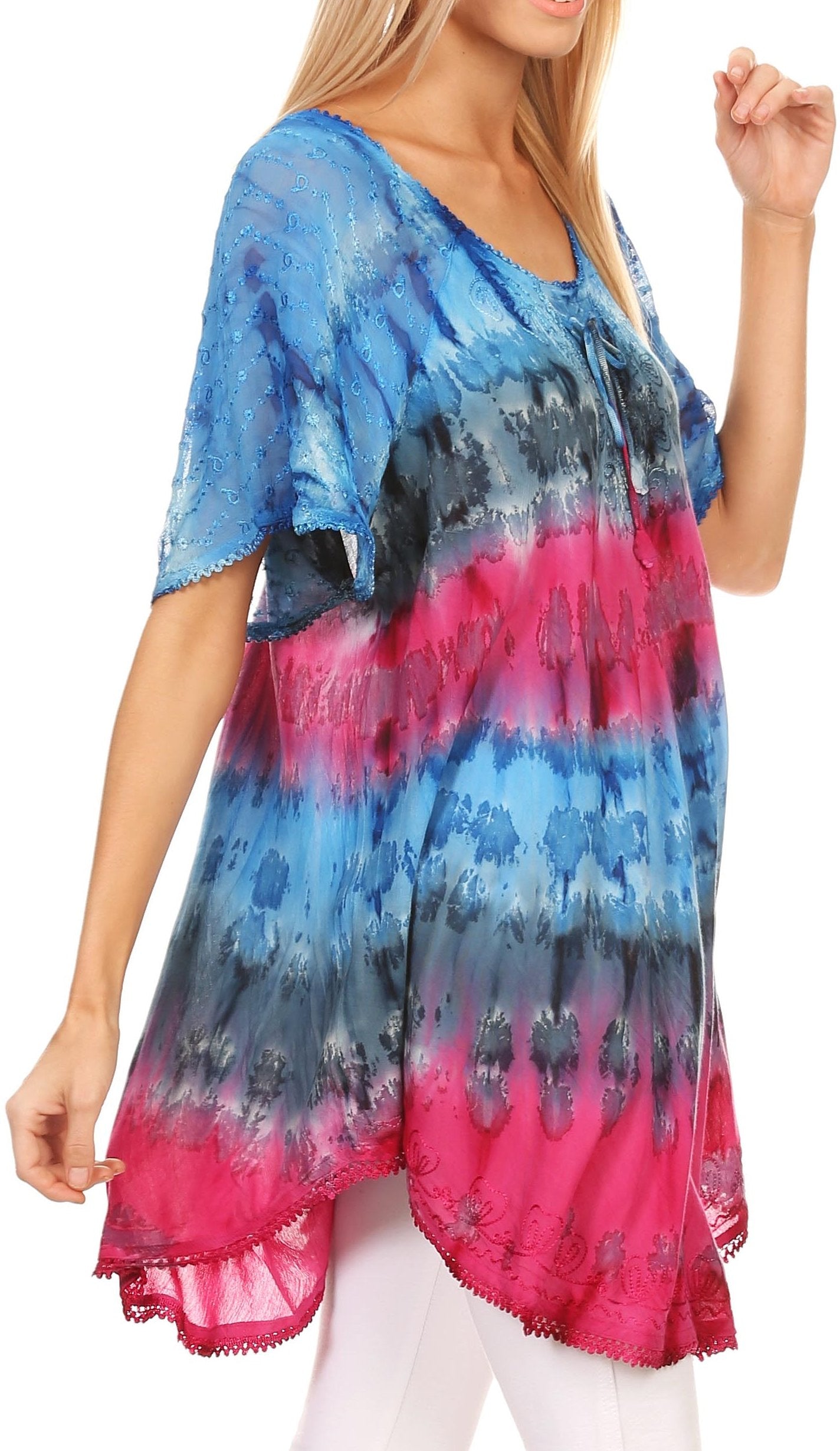 Woman wearing a tie-dye shirt with blue, pink, and black gradient.