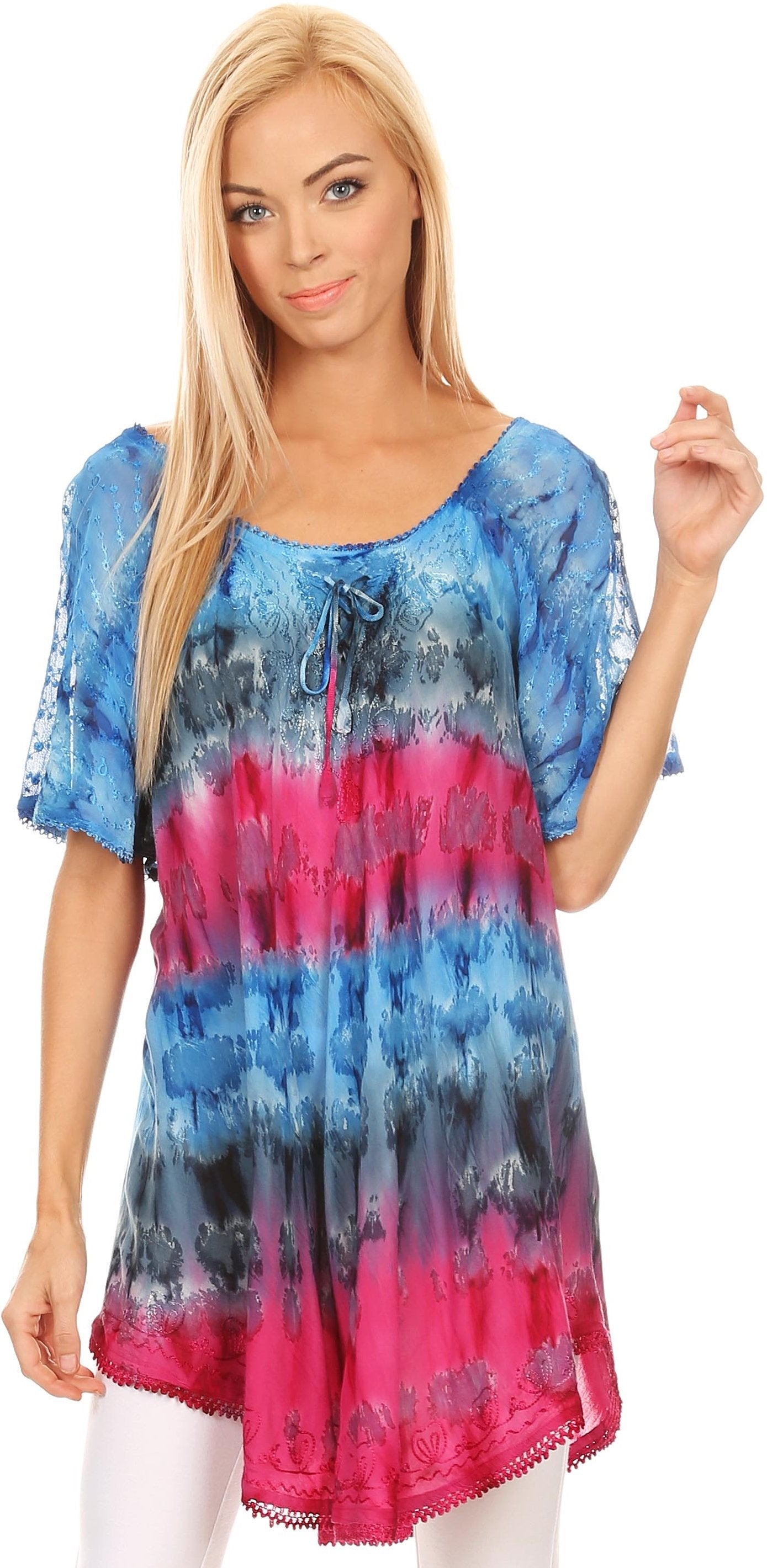 Woman wearing a colorful tie-dye top on a white background