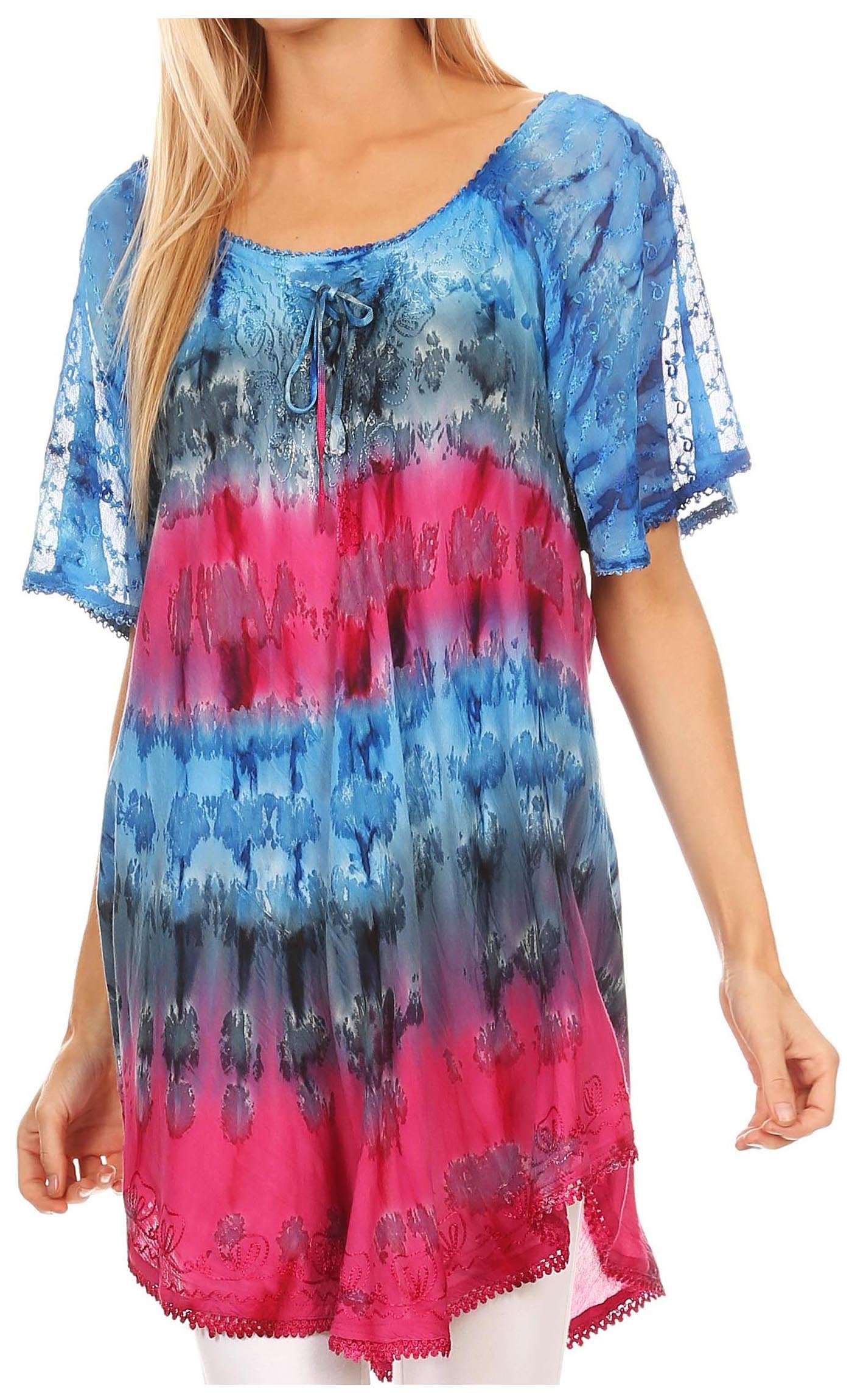 Woman wearing a colorful tie-dye shirt with blue, pink, and black gradient.