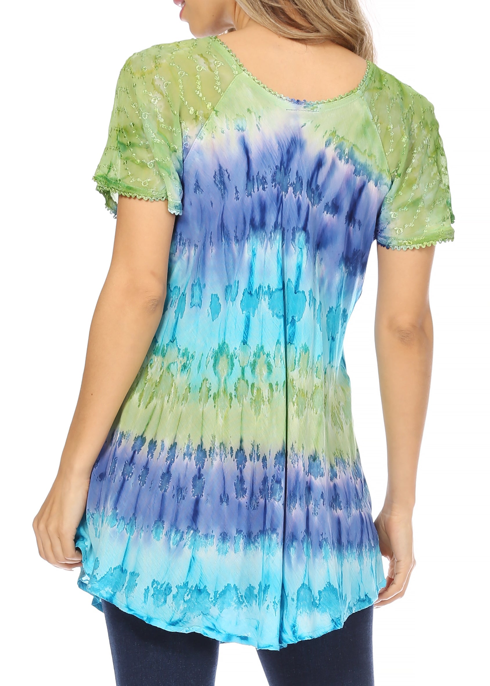 Woman wearing a tie-dye shirt with green, blue, and purple colors on a white background