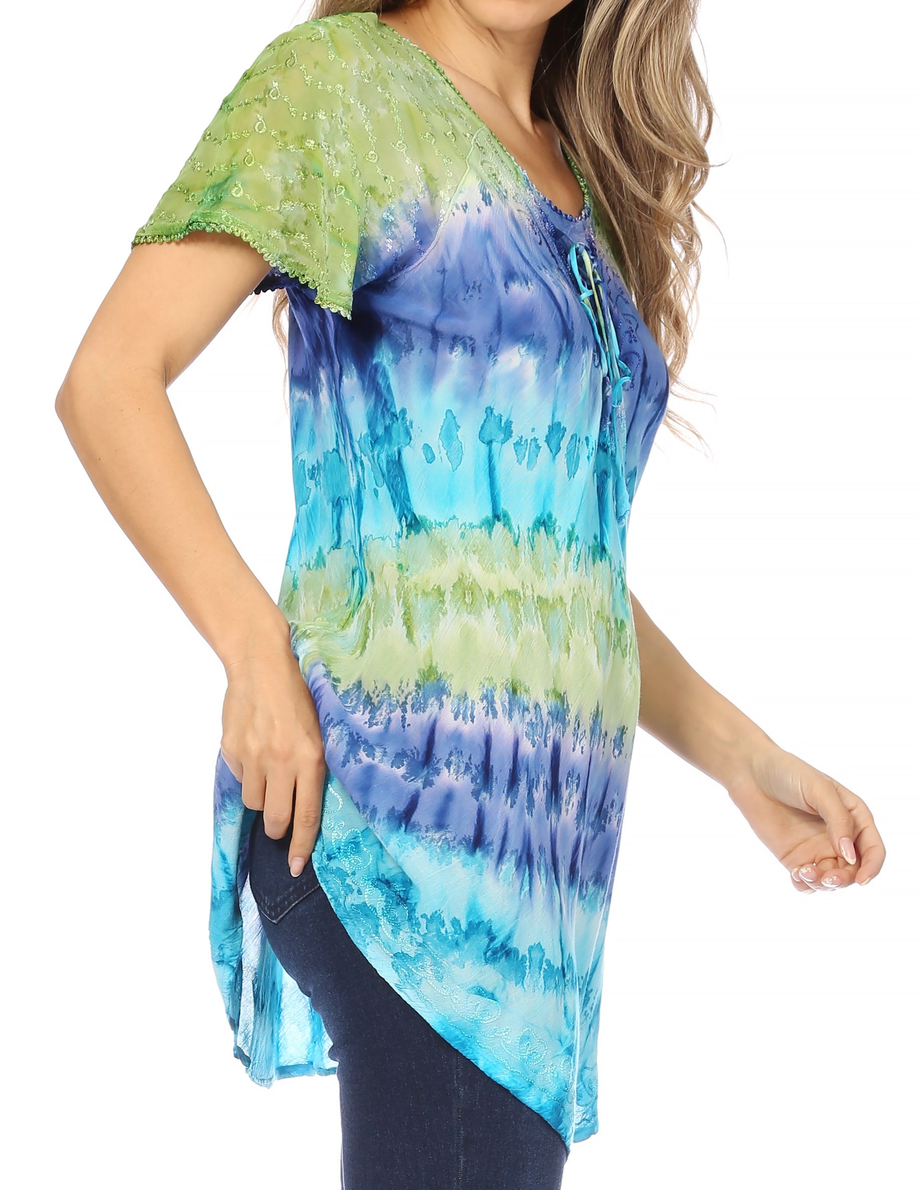 Woman wearing a tie-dye shirt with blue and green colors on a white background