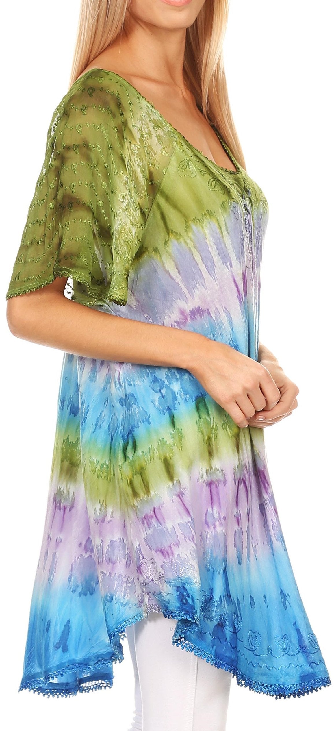 Woman wearing a tie-dye shirt with green, blue, and purple colors.