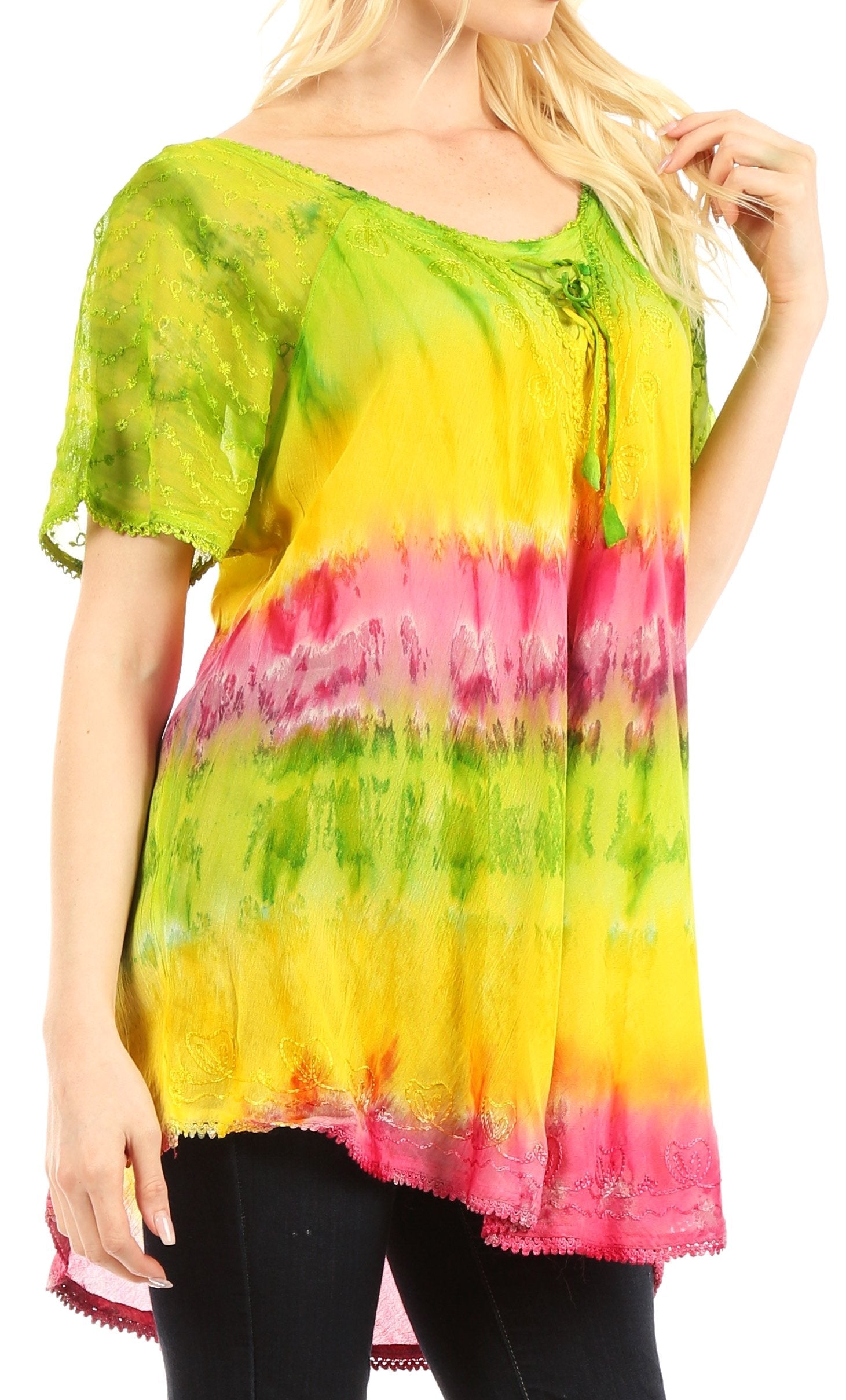 Woman wearing a colorful tie-dye top with green, yellow, and pink hues on a white background.