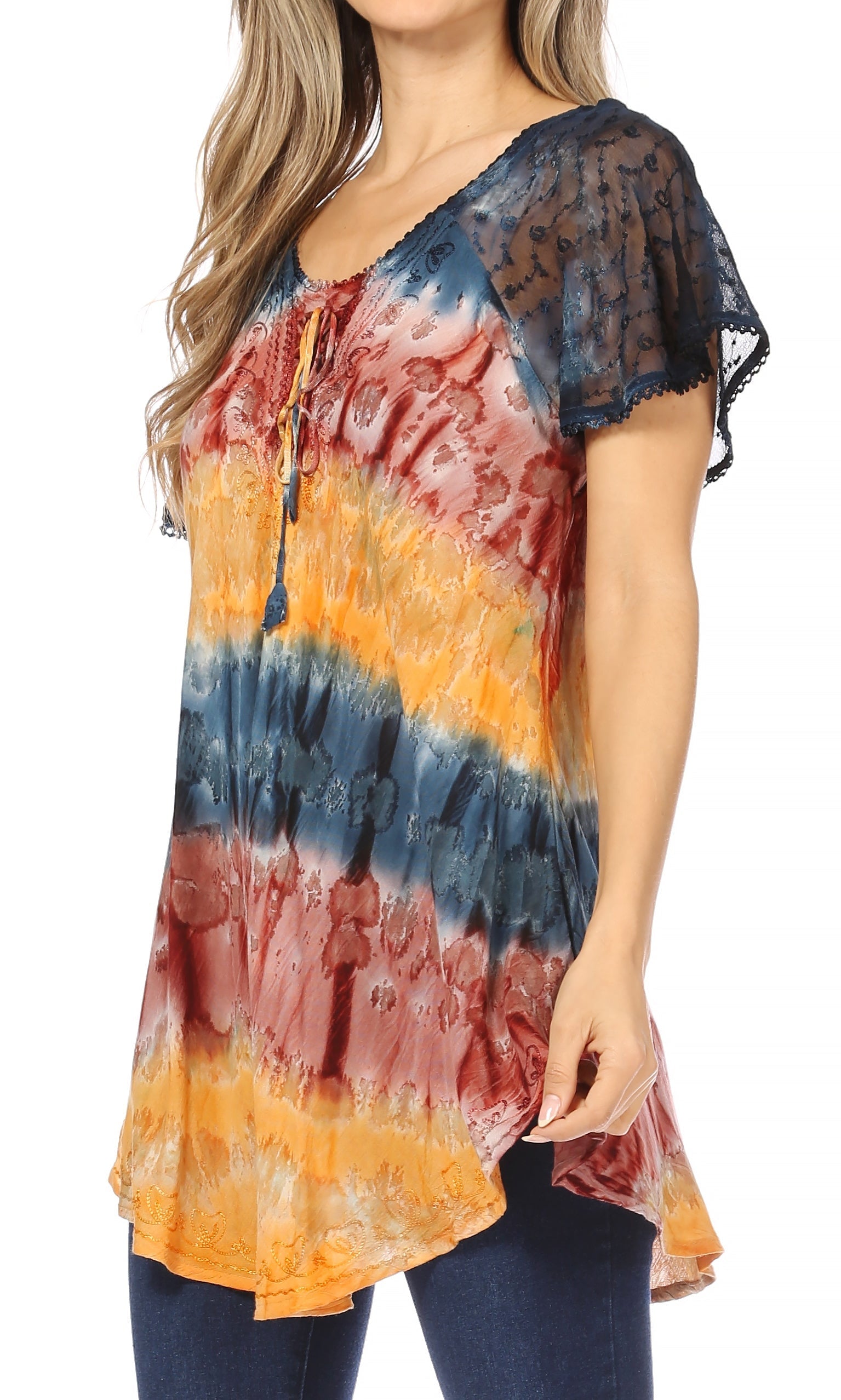 Woman wearing a tie-dye shirt with a colorful pattern on a white background