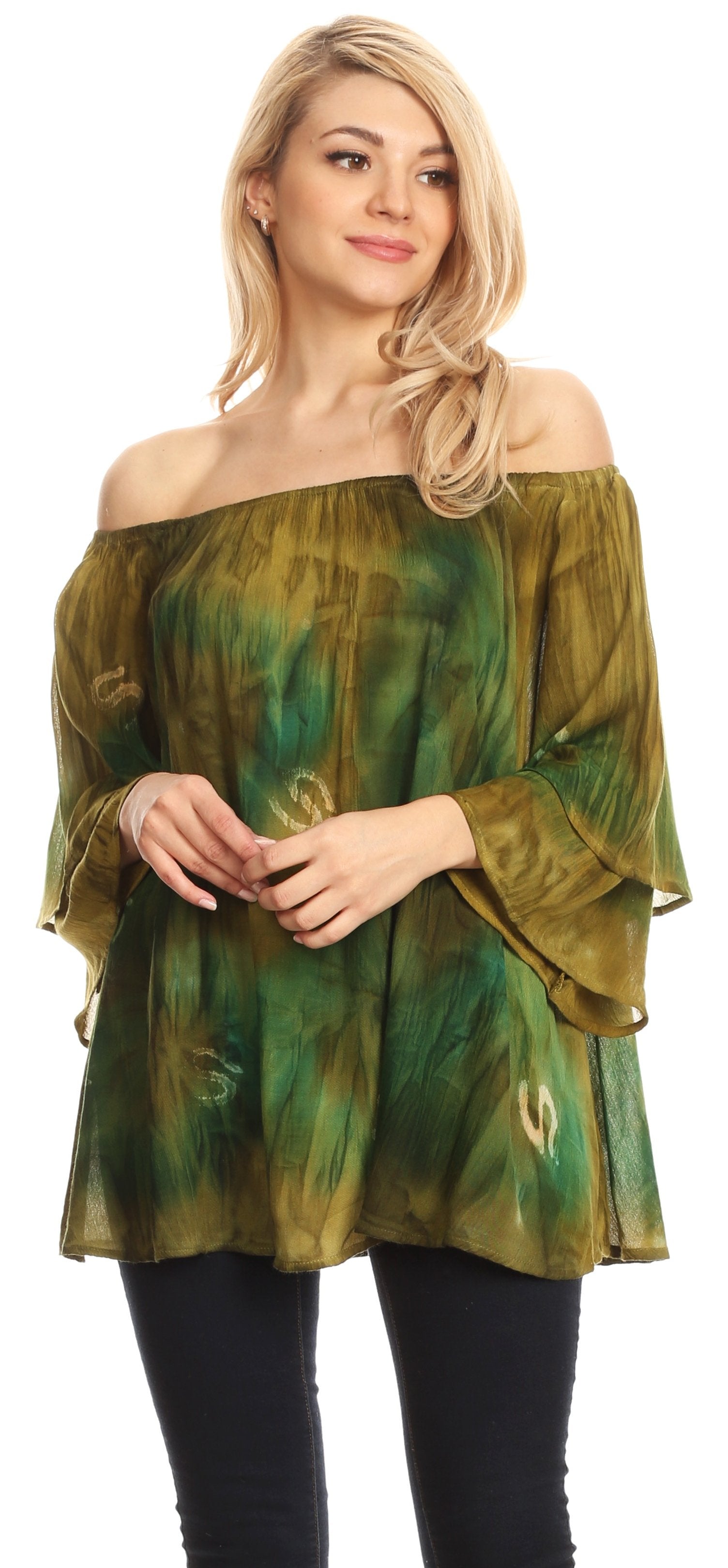 Woman wearing a green off-shoulder top with black pants on a white background