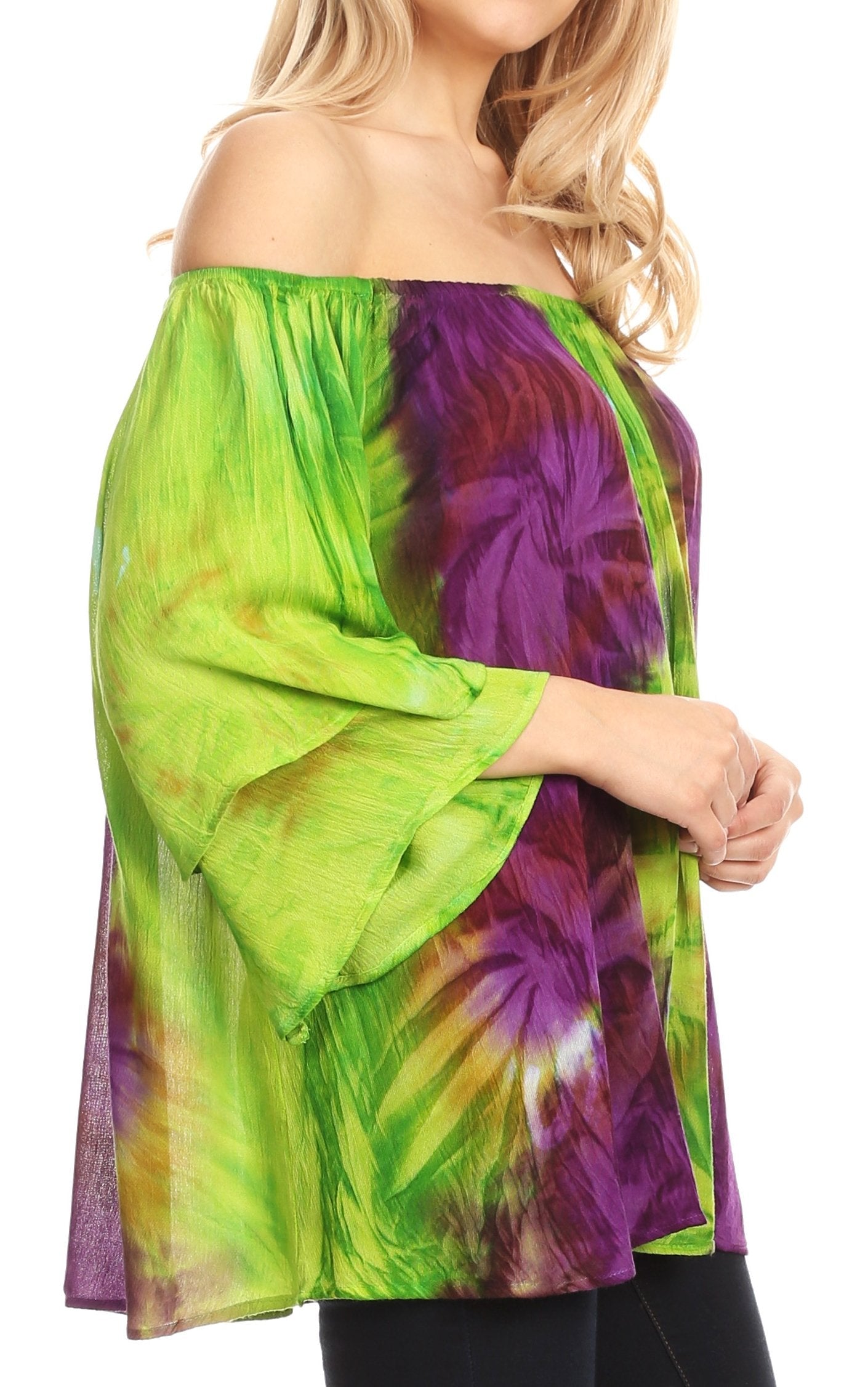 Woman wearing a colorful tie-dye off-shoulder top on a white background