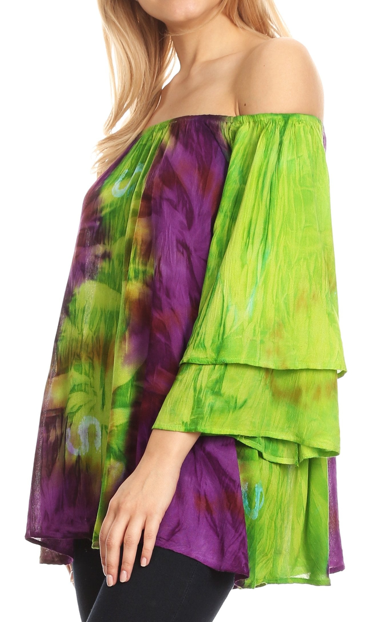 Green and purple layered top worn by a person on a white background