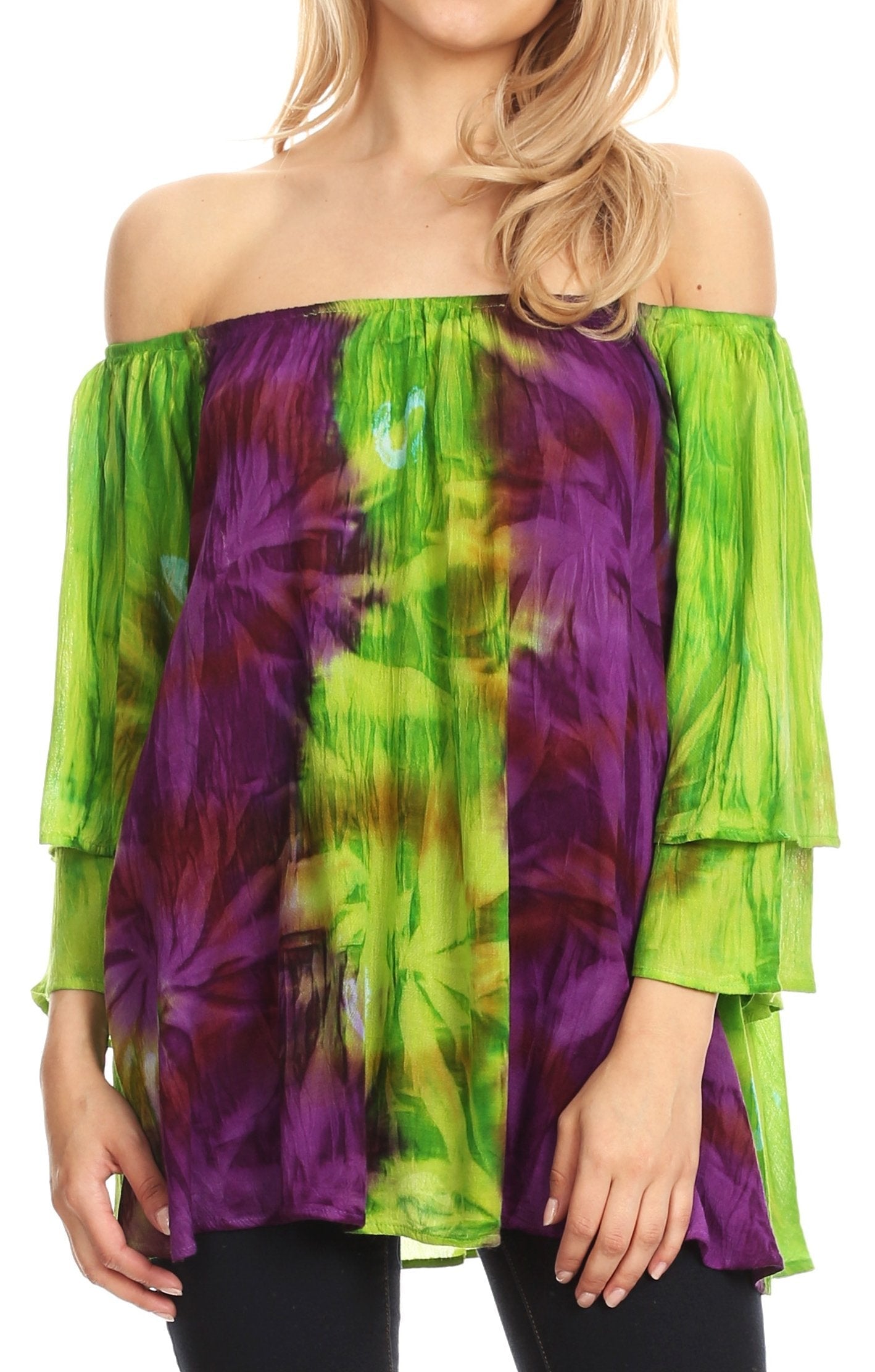 Woman wearing a colorful tie-dye off-shoulder top with green and purple hues.