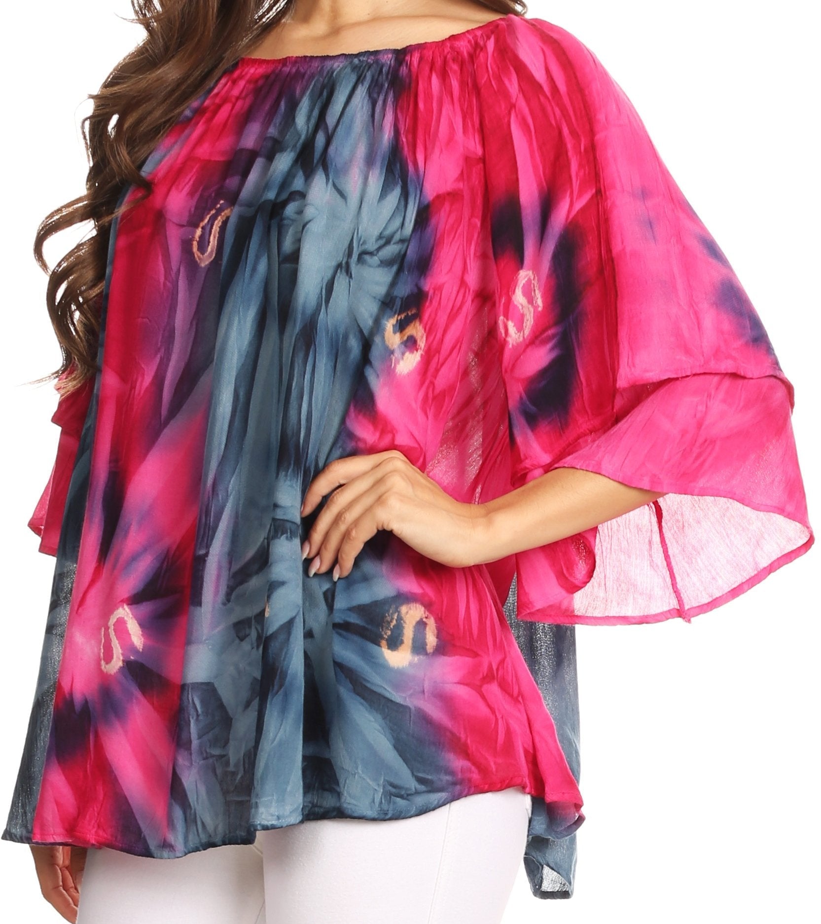 Colorful tie-dye top worn by a person on a white background